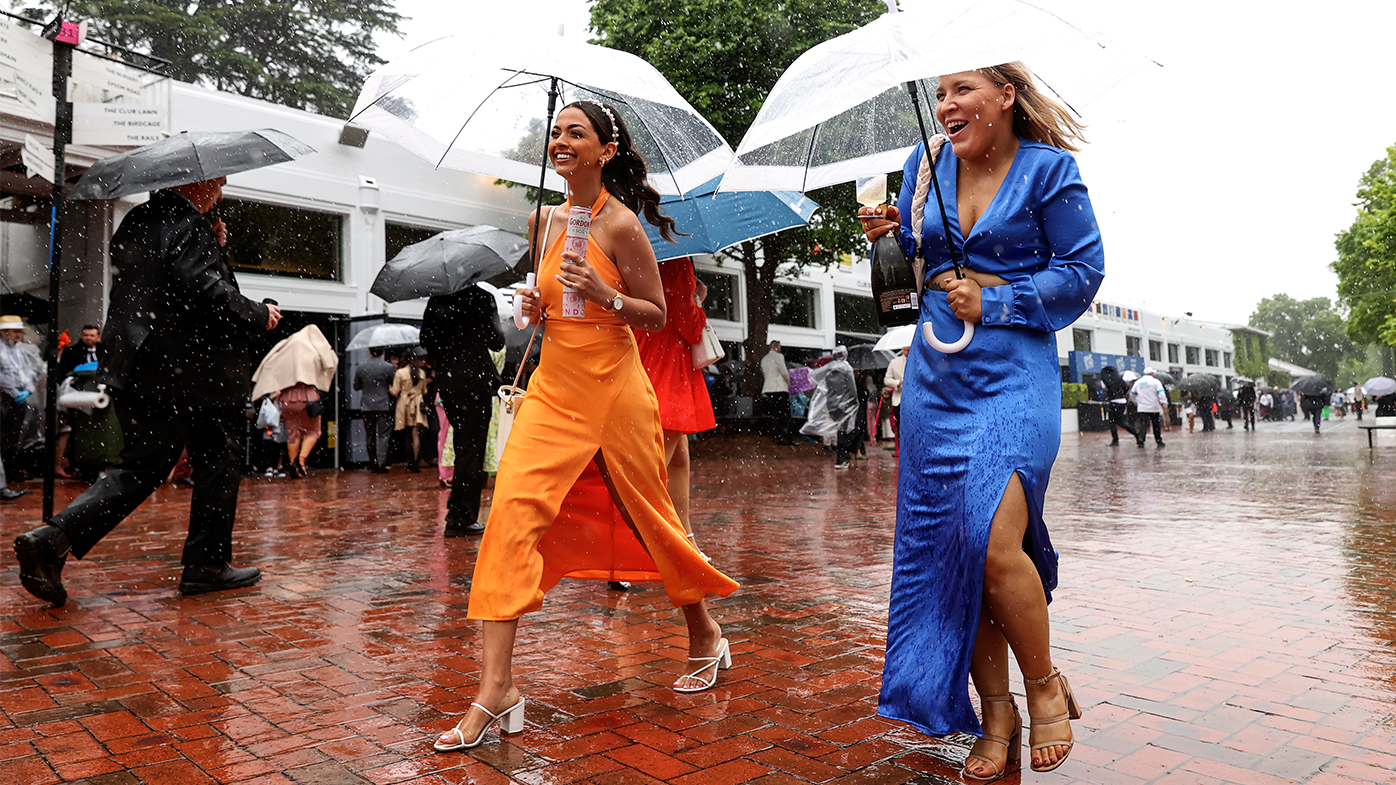 Melbourne Cup 2022 in pictures Punters brave rain, wet conditions at Flemington Photos of race image