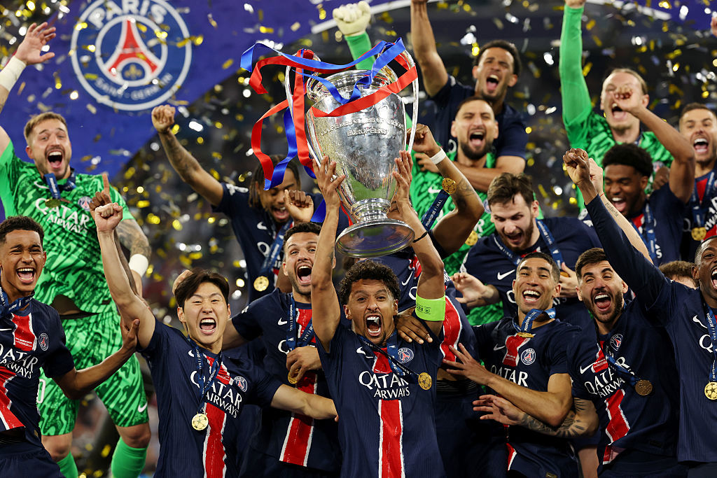 Marquinhos of Paris Saint-Germain lifts the Champions League trophy.
