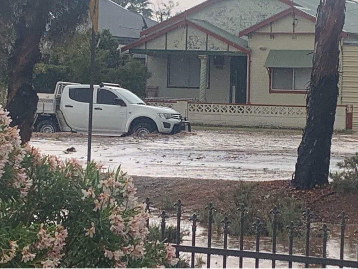 The flash flooding reached half-way up this 4WD ute's wheels.