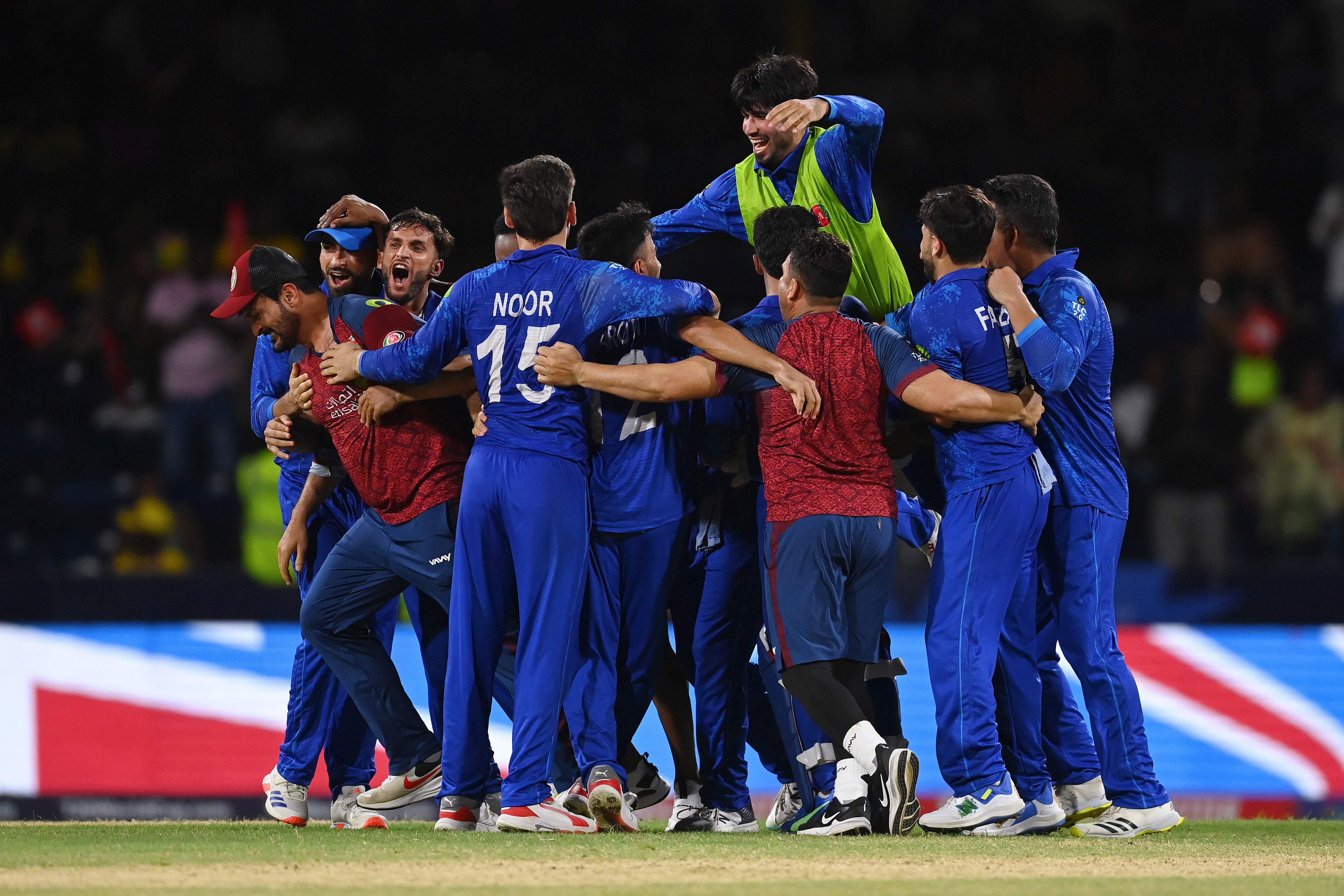 Afghanistan players celebrate winning the ICC Men's T20 Cricket World Cup West Indies & USA 2024 Super Eight match between Afghanistan and Australia at Arnos Vale Ground on June 22, 2024 in St Vincent, Saint Vincent and The Grenadines. (Photo by Gareth Copley/Getty Images)