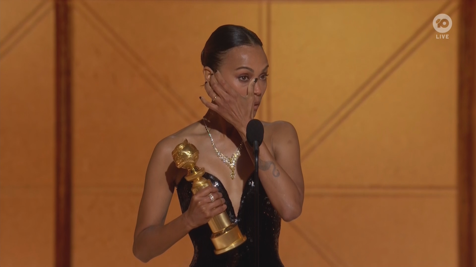 Zoe Saldana burst into tears as she accepted her first Golden Globe.