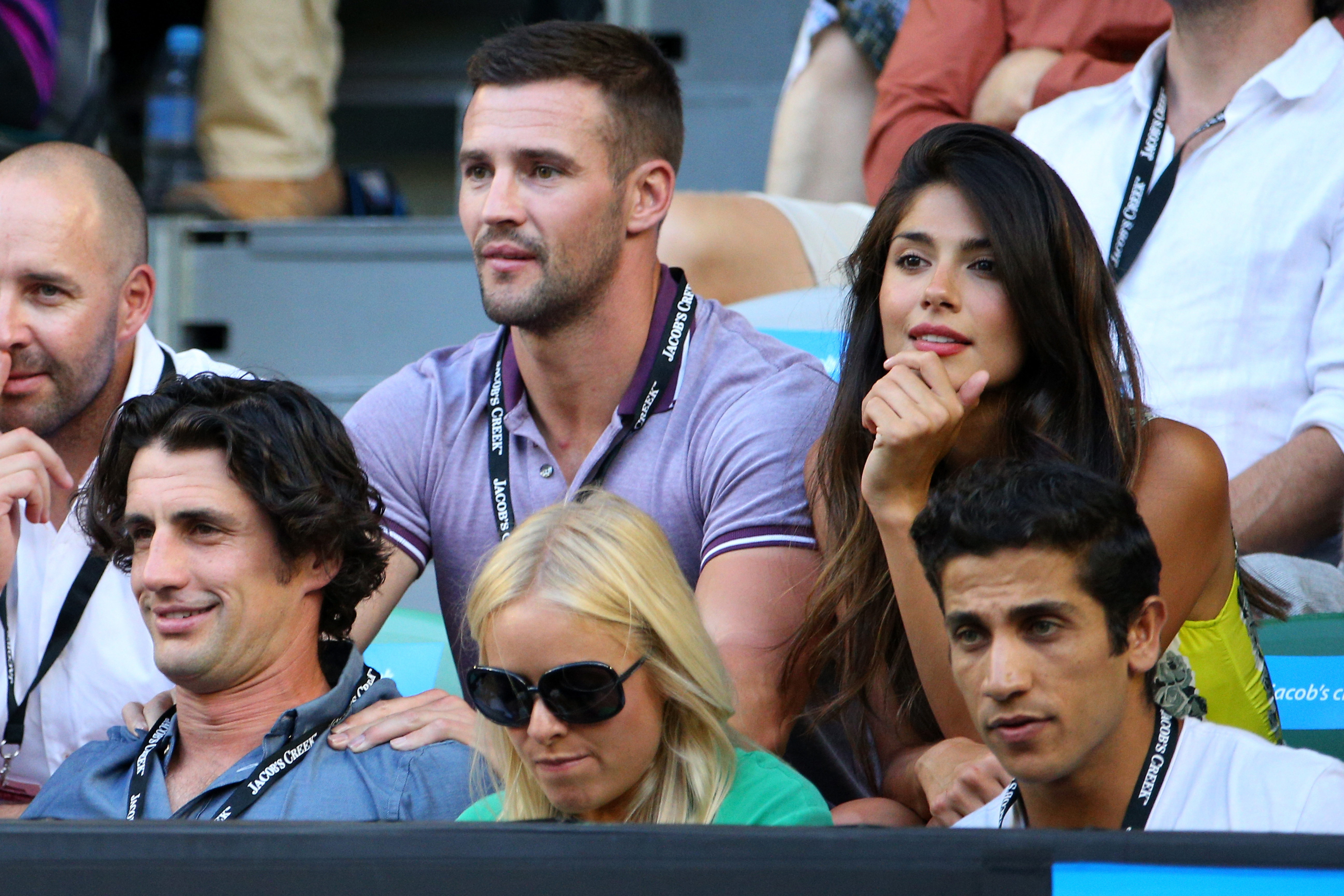 Kris Smith, Pia Miller, Firass Dirani and Andy Lee watch the Men's Semifinal match between David Ferrer of Spain and Novak Djokovic of Serbia during day 11 of the 2013 Australian Open on January 24, 2013 in Melbourne, Australia