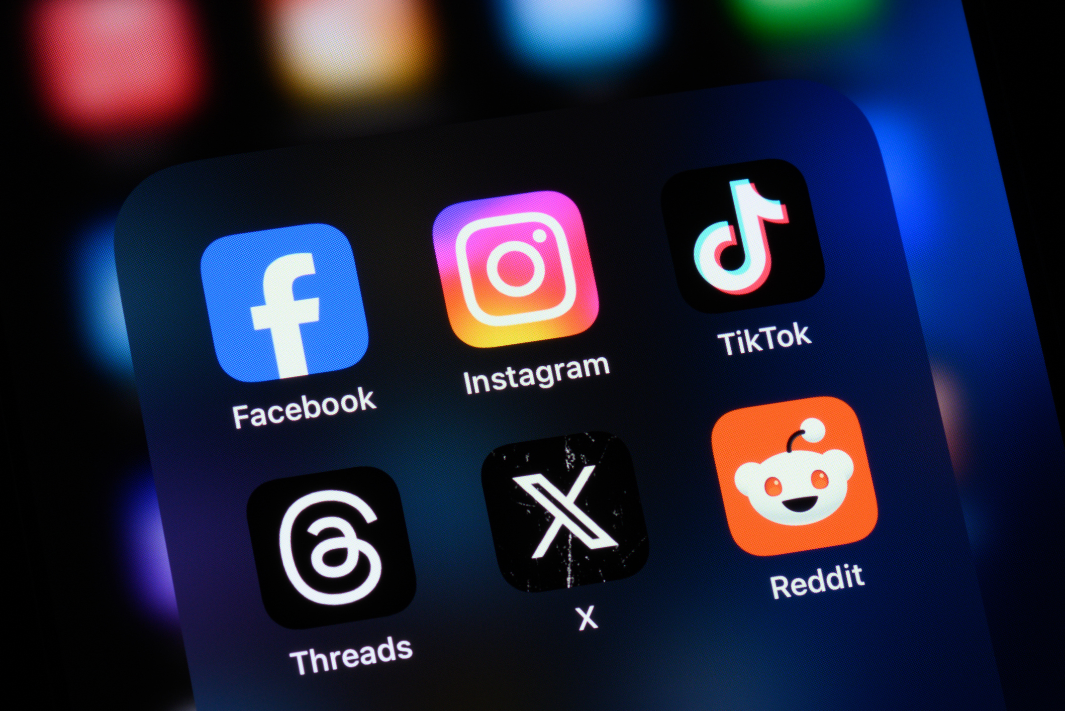 Toronto, Canada - August 22, 2024:    Popular social media apps on an Apple iPhone: Facebook, Instagram, TikTok, Threads, X (formerly Twitter), and Reddit.