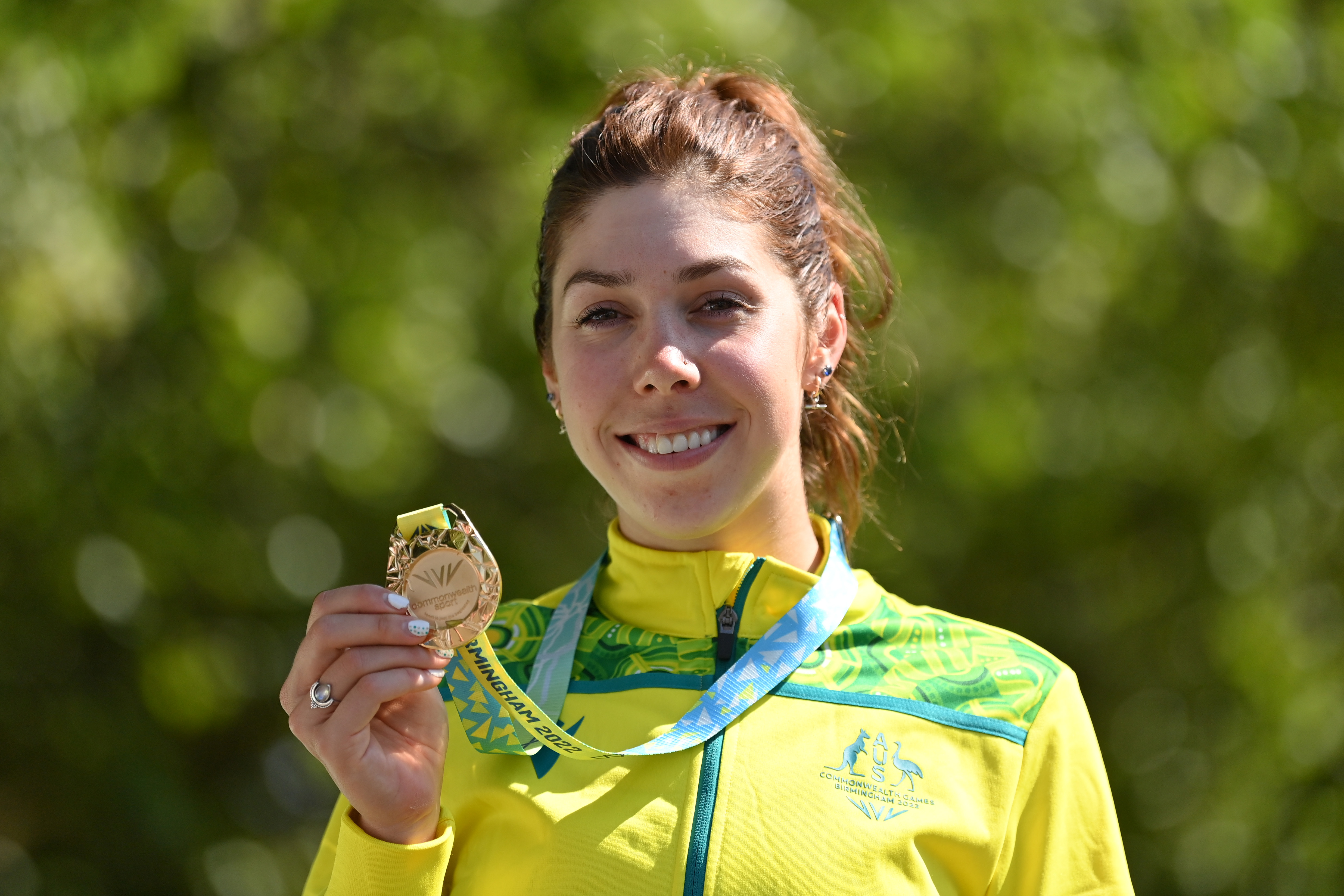 Gold Medalist, Georgia Baker of Team Australia celebrates with their medal during the Women's Road Race medal ceremony on day ten of the Birmingham 2022 Commonwealth Games at  on August 07, 2022 on the Warwick, England. (Photo by Justin Setterfield/Getty Images)