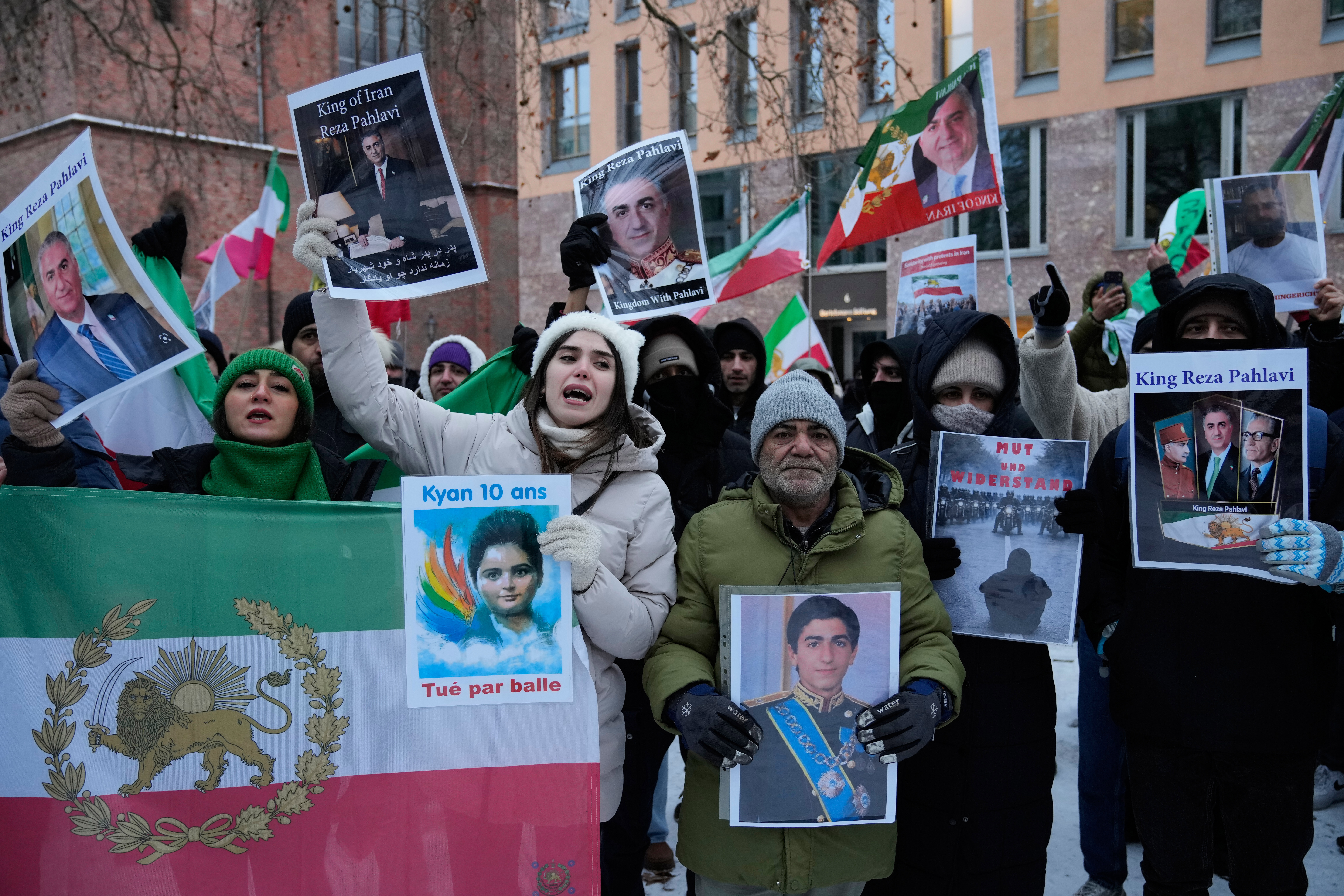 Protesters showing pictures of Reza Pahlavi