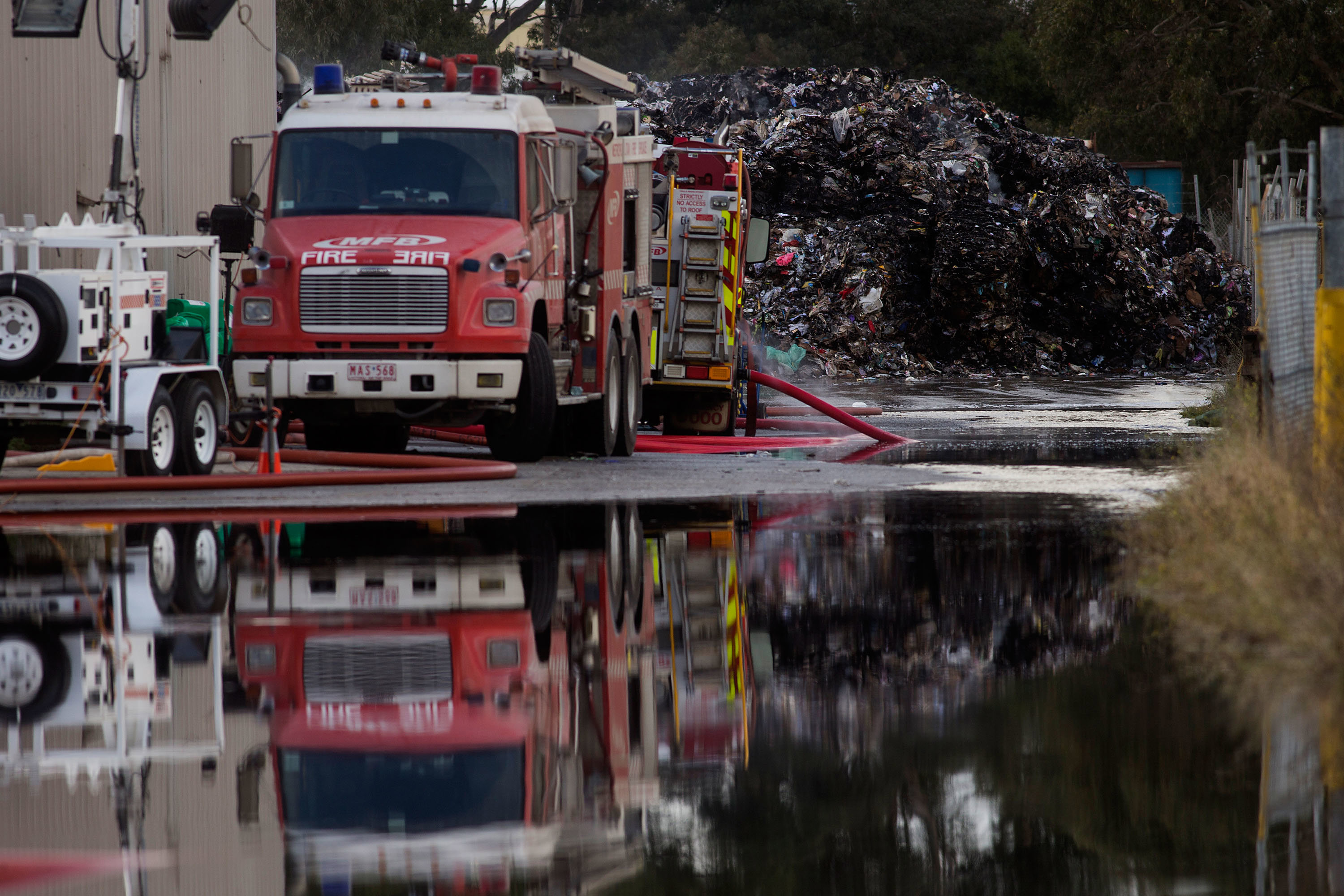 Director faults firefighters over toxic recycling fire that triggered state emergency