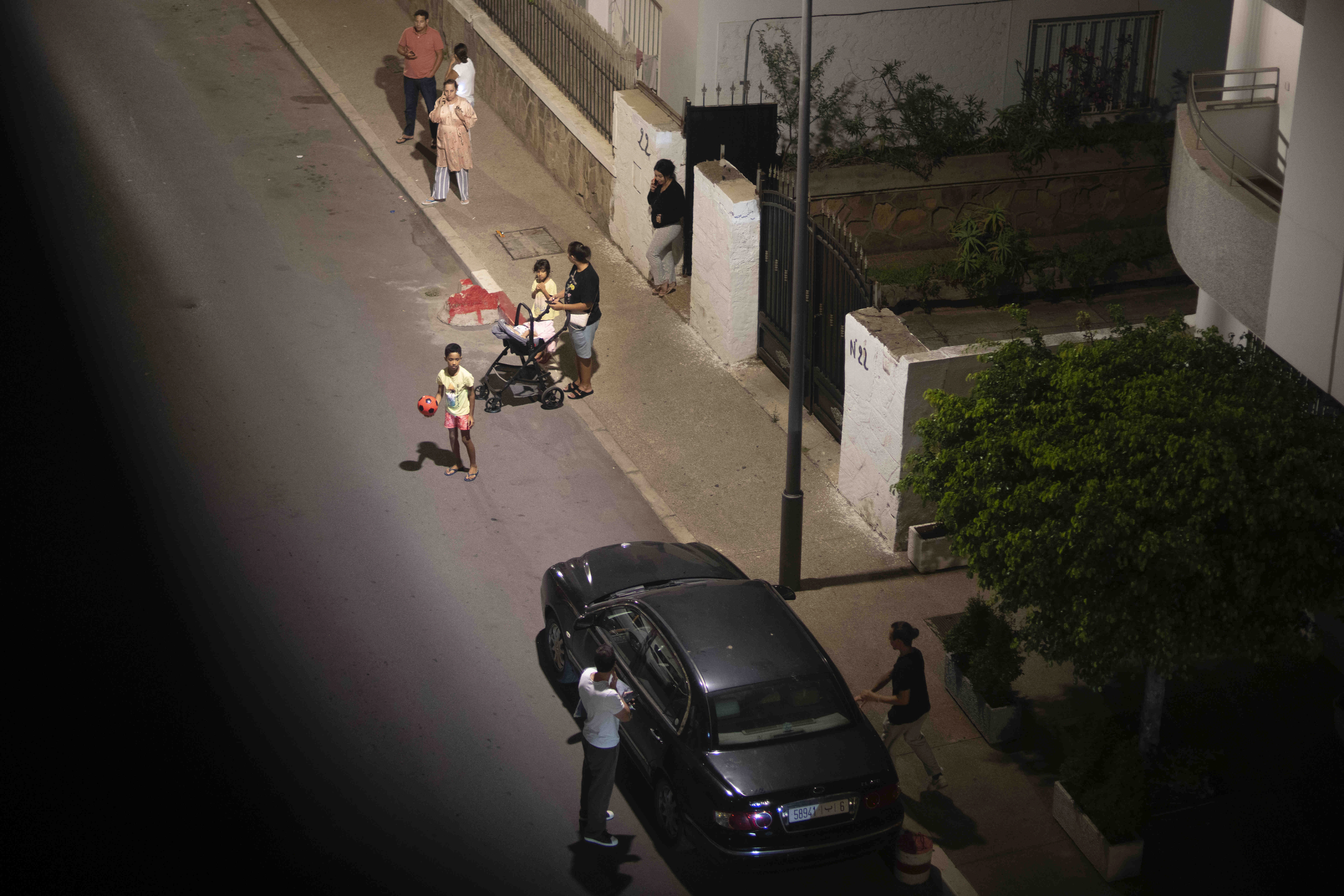 People take shelter outside their homes after an earthquake in Rabat, Morocco, Friday, Sept. 8, 2023. 