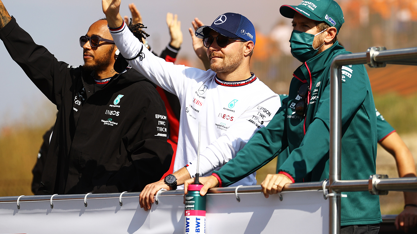 Valtteri Bottas (centre) with Lewis Hamilton and Sebastian Vettel.