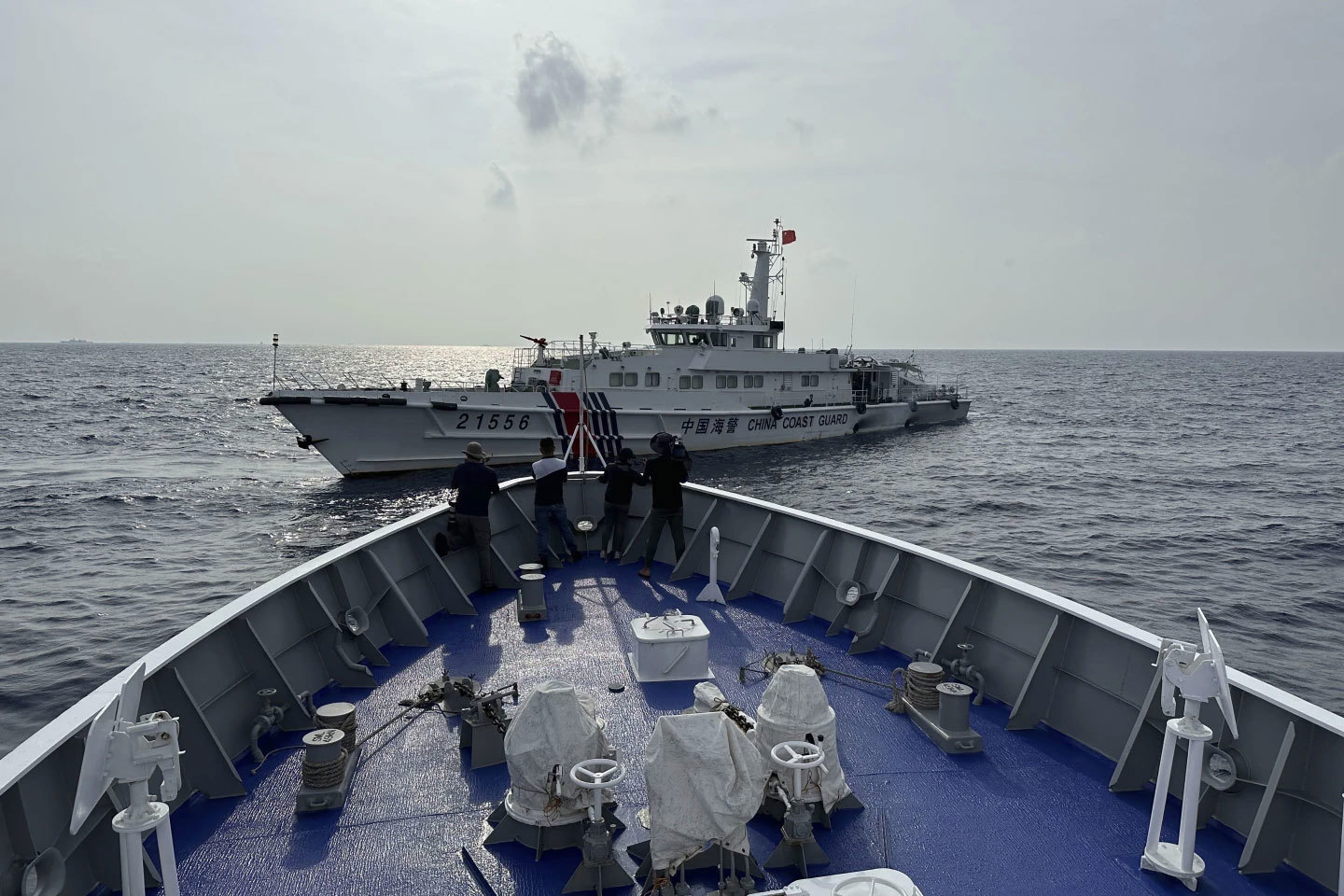 A Chinese coast guard ship blocks a coast guard vessel from the Philippines.