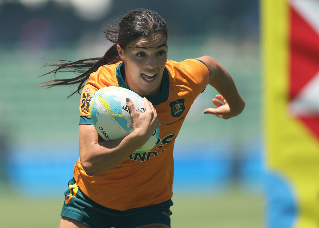 Madison Ashby of Australia runs in for a try.