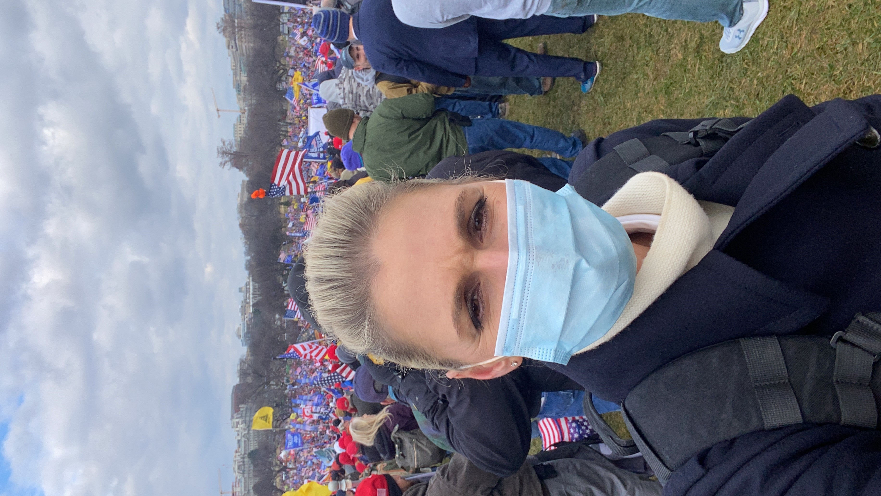 Amelia masked up outside a Trump rally.