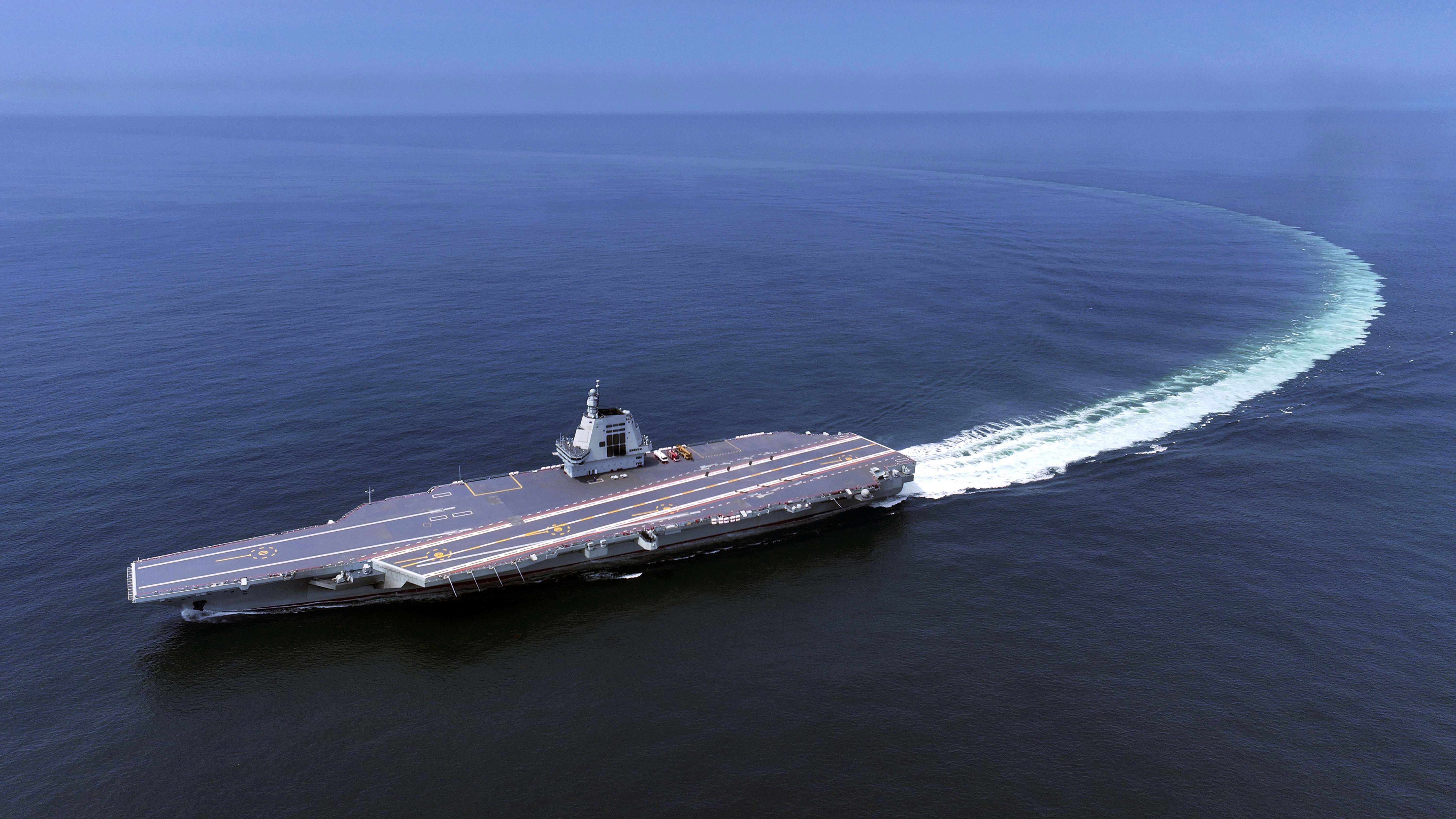 In this photo released by Xinhua News Agency, China's third conventionally powered aircraft carrier, the Fujian, conducts a maiden sea trial on May 7, 2024.