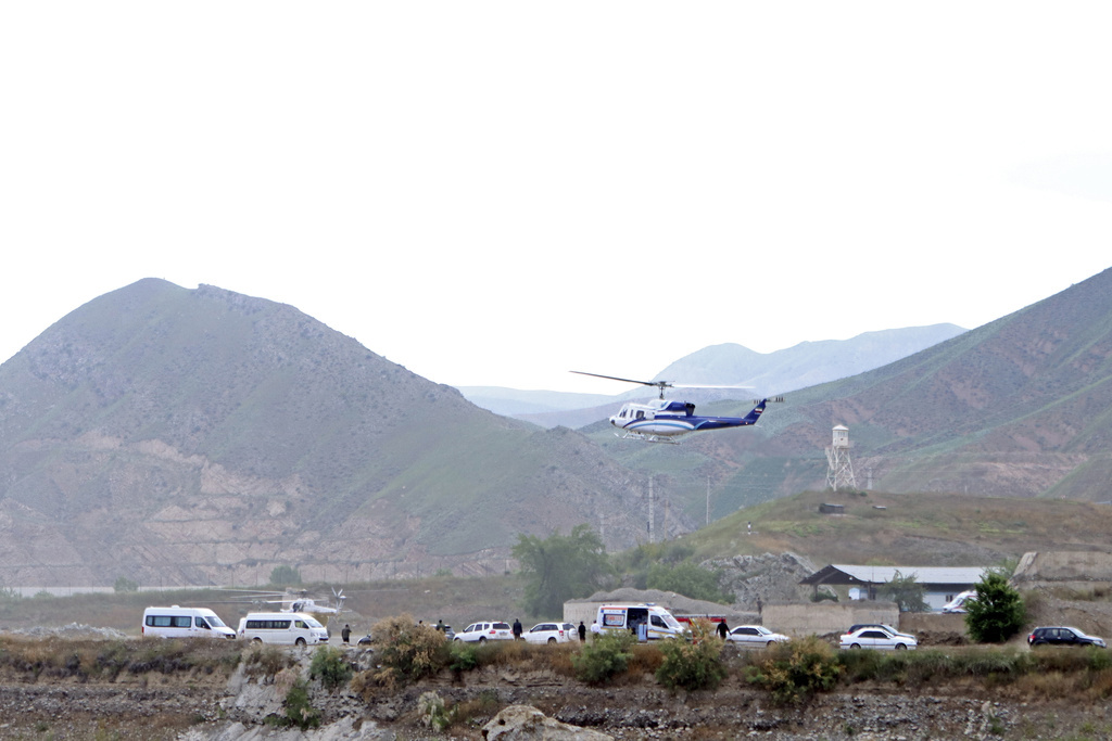 In this photo provided by Islamic Republic News Agency, IRNA, the helicopter carrying Iranian President Ebrahim Raisi takes off at the Iranian border with Azerbaijan.