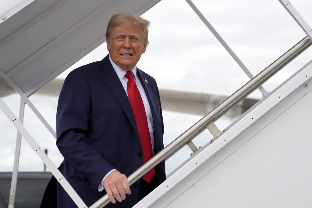 Donald Trump boards his plane at West Palm Beach International Airport, Saturday, October 5, 2024, in West Palm Beach