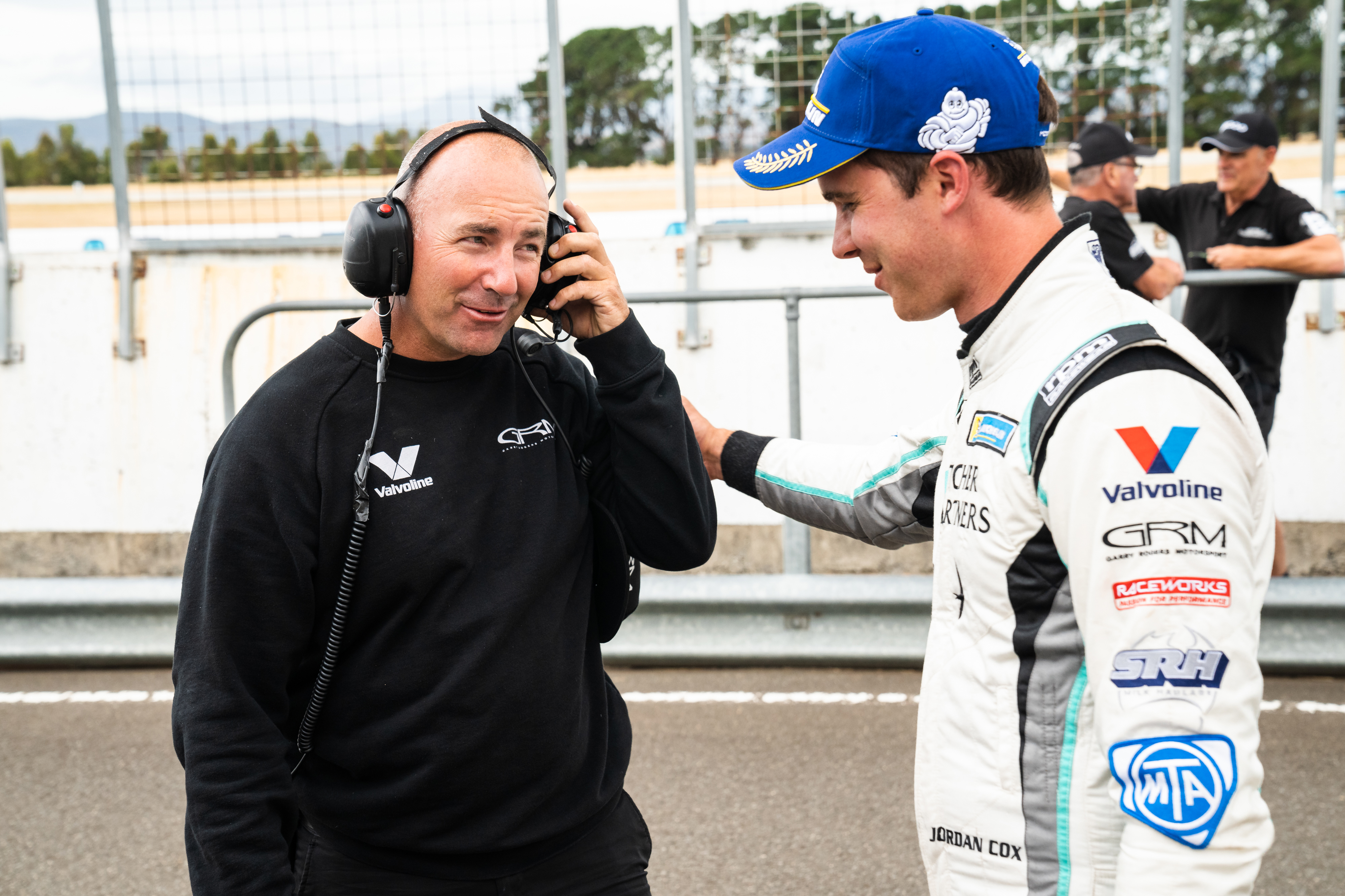 Marcos Ambrose (left) with Garry Rogers Motorsport driver Jordan Cox.