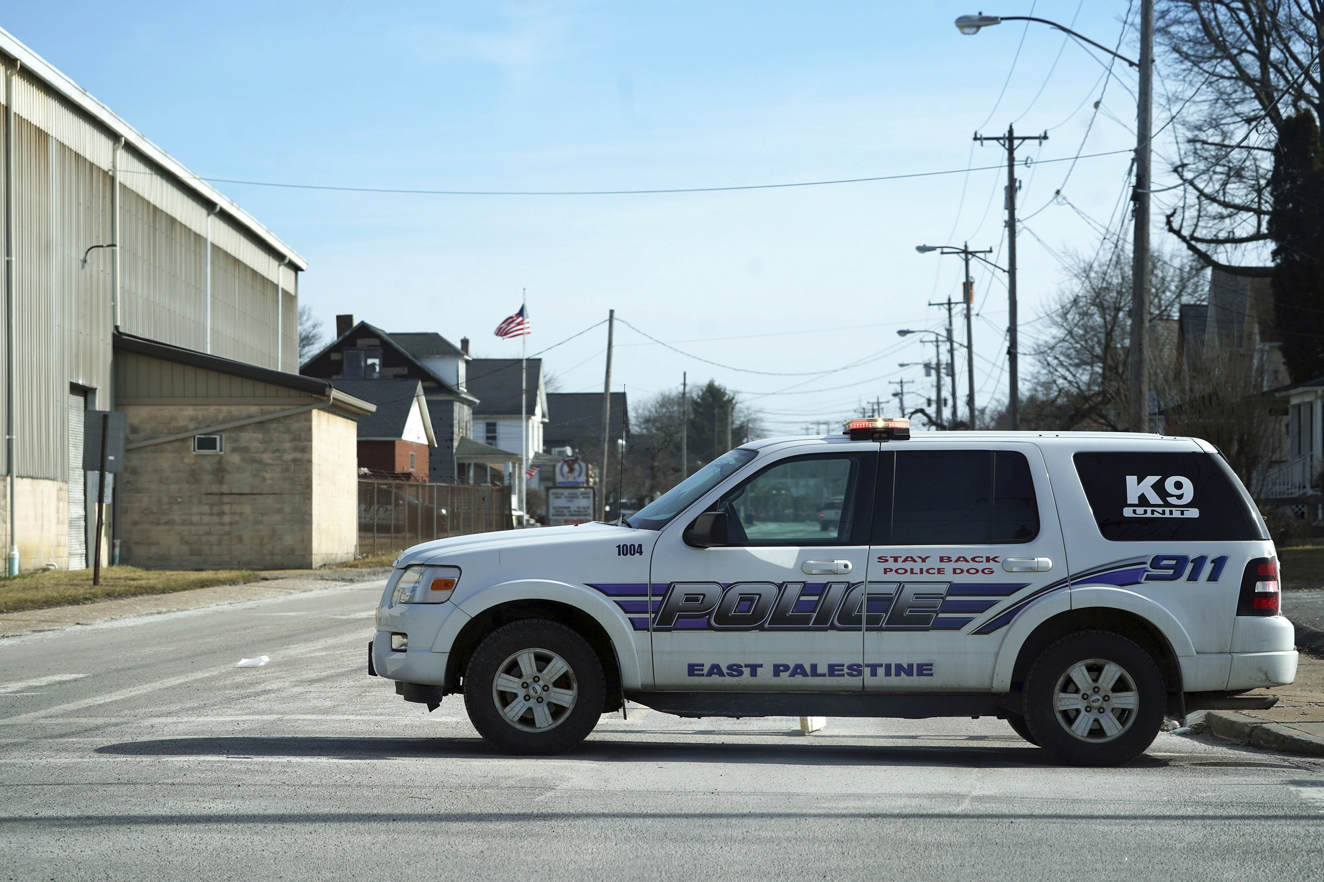 East Palestine police block roads in downtown East Palestine, Ohio, on Sunday, Feb. 5, 2023. 