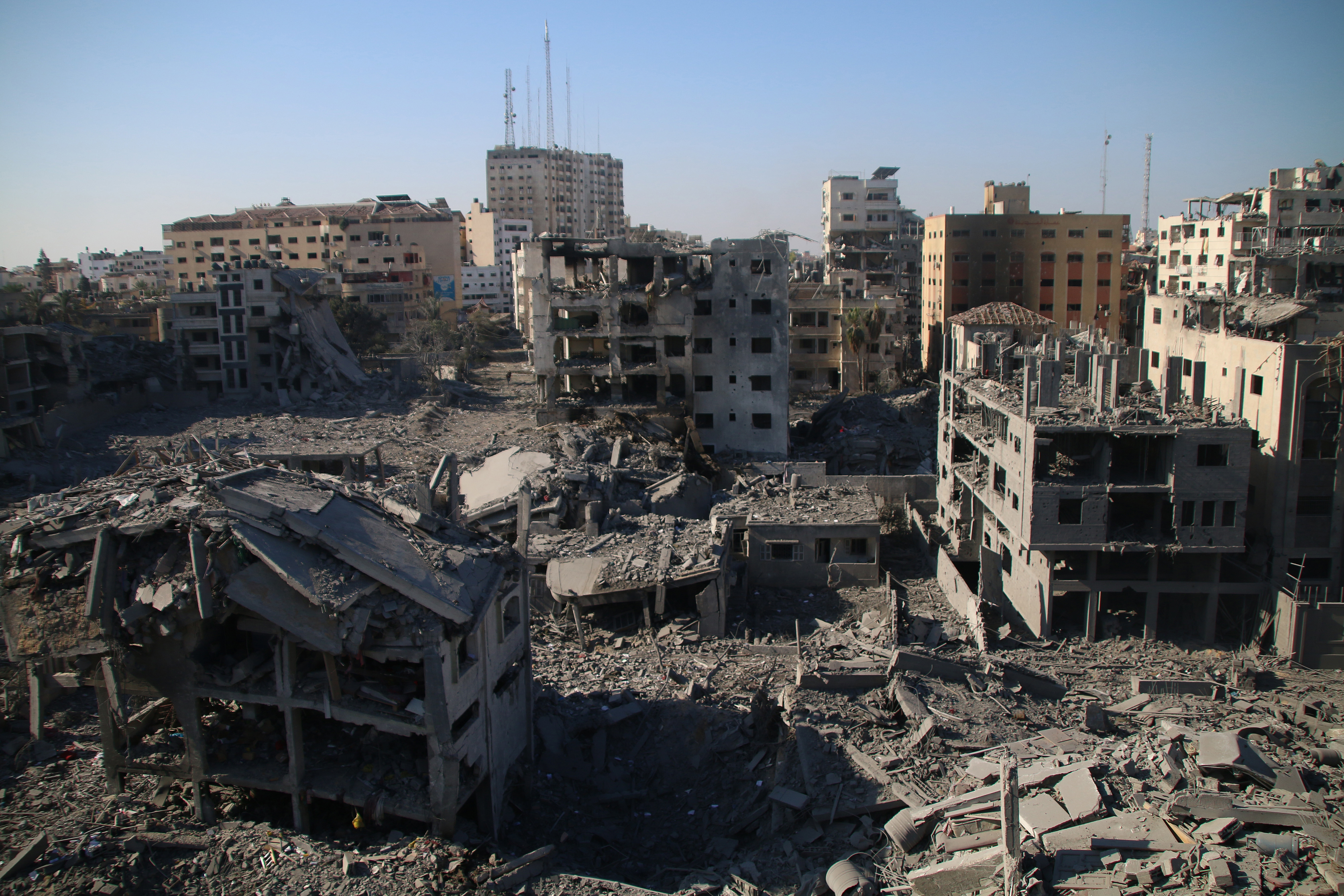 Palestinian citizens inspect damage to their homes caused by Israeli airstrikes on October 13, 2023 in Gaza City, Gaza.