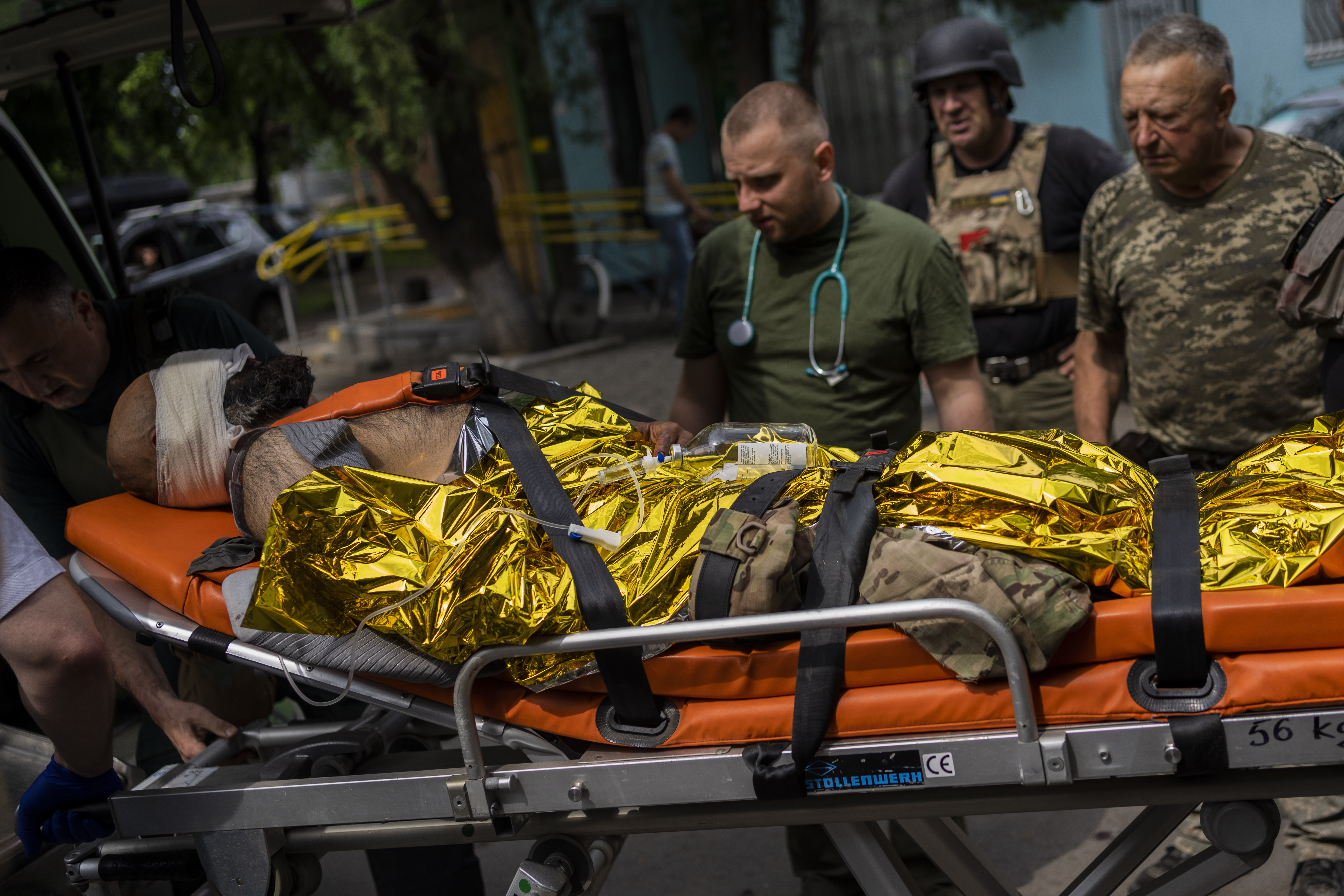 An injured Ukrainian serviceman is evacuated to a hospital in the Donetsk oblast region, eastern Ukraine, Sunday, June 5, 2022. (AP Photo/Bernat Armangue)