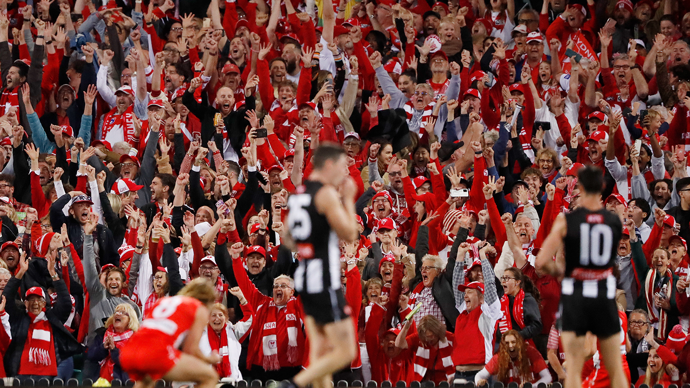 Fans react after the final siren of the 2022 AFL second preliminary final between the Sydney Swans and the Collingwood Magpies at the Sydney Cricket Ground .