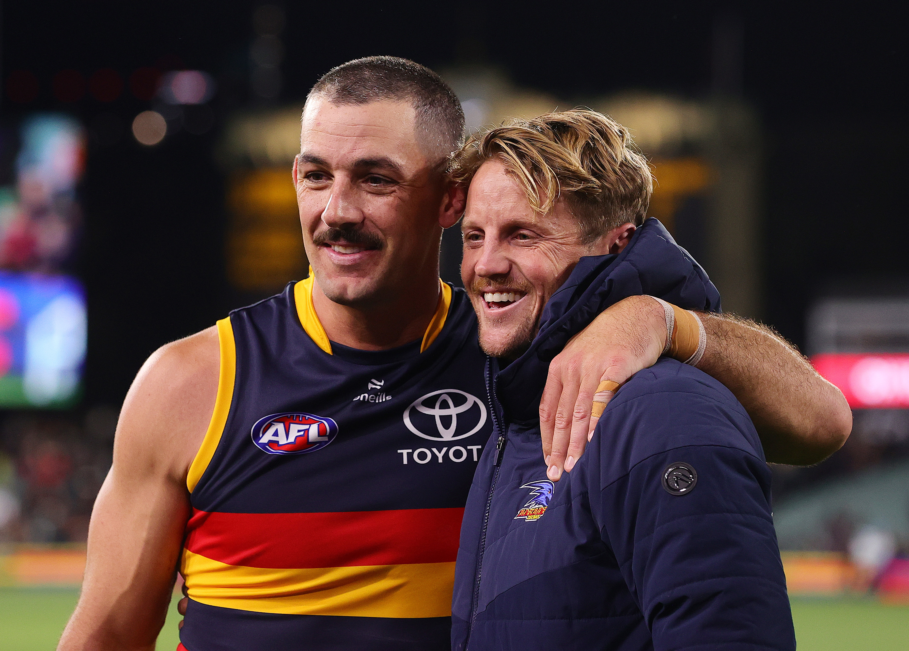 Taylor Walker (left) and Rory Sloane in Adelaide colours.