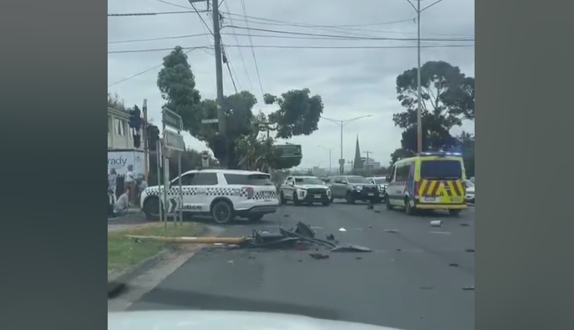 Debris was strewn across the ground as police and an ambulance swarmed the scene.