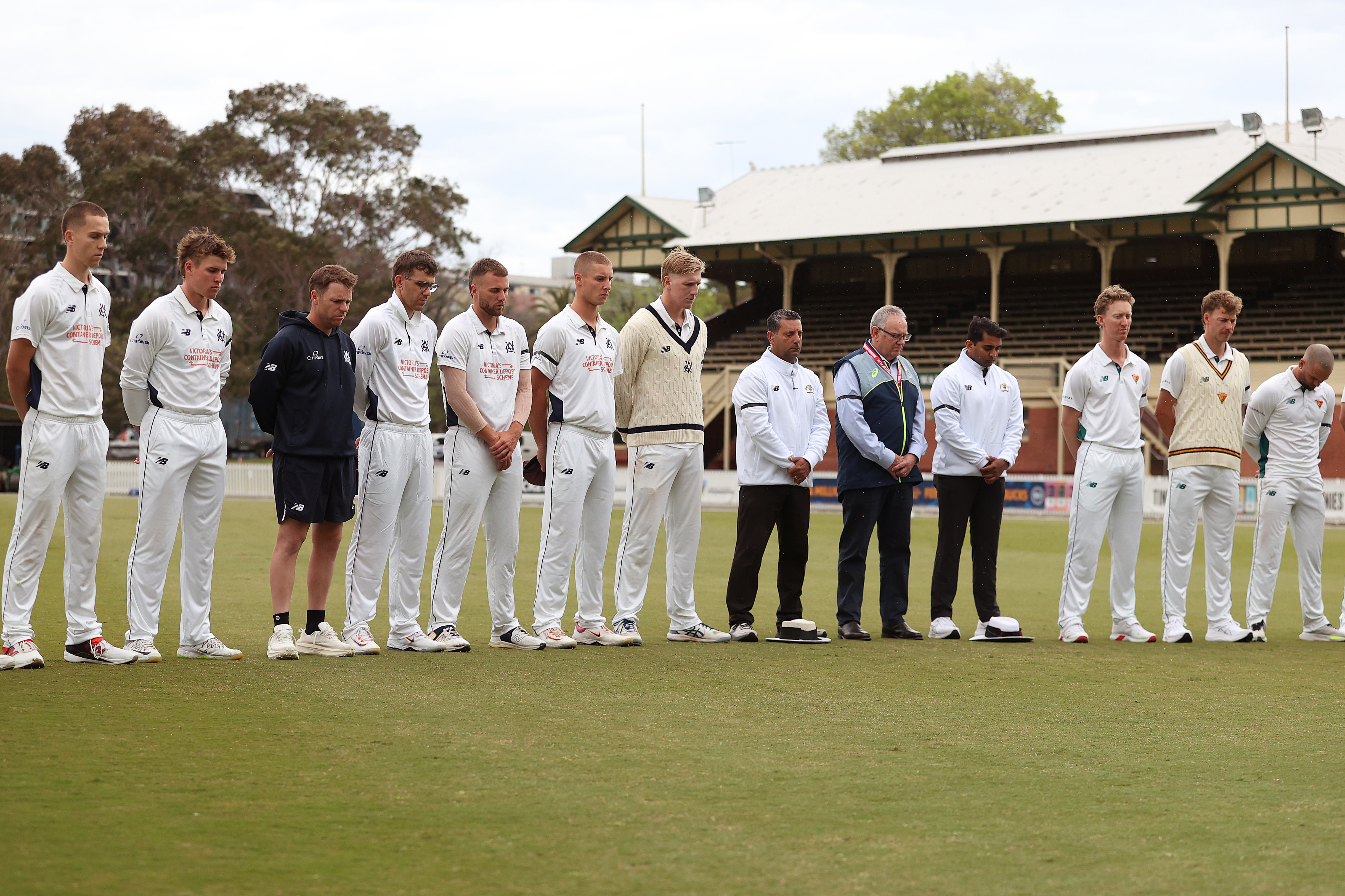Tasmanian and Victorian players observe a minutes silence during a tribute for Ben Austin during day four of the Sheffield Shield  match between Victoria and Tasmania at CitiPower Centre, on October 31, 2025, in Melbourne, Australia.