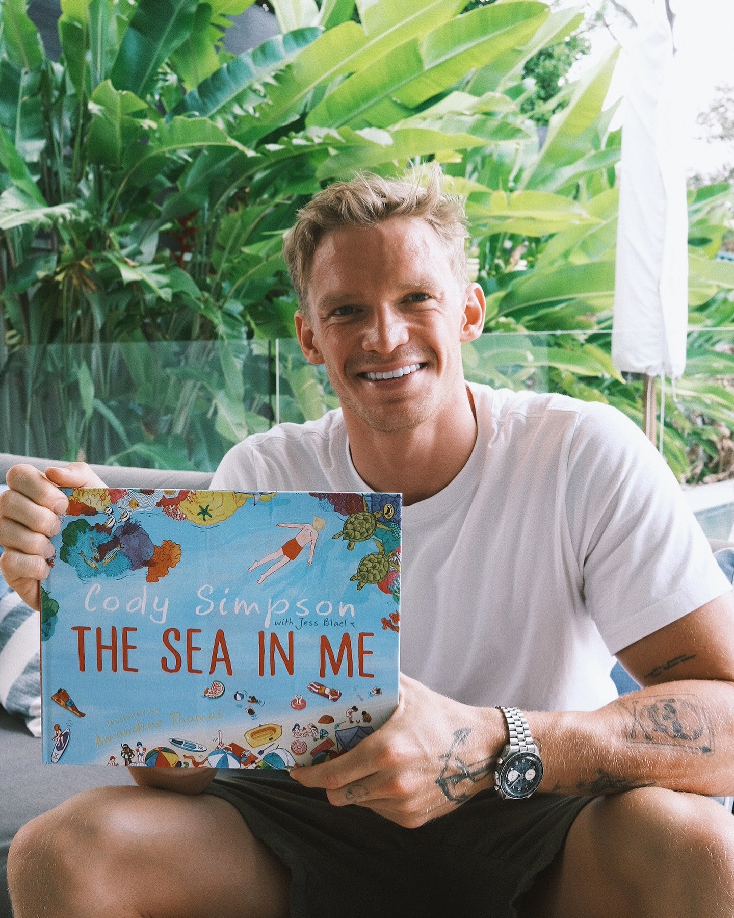 Cody Simpson with his book The Sea In Me