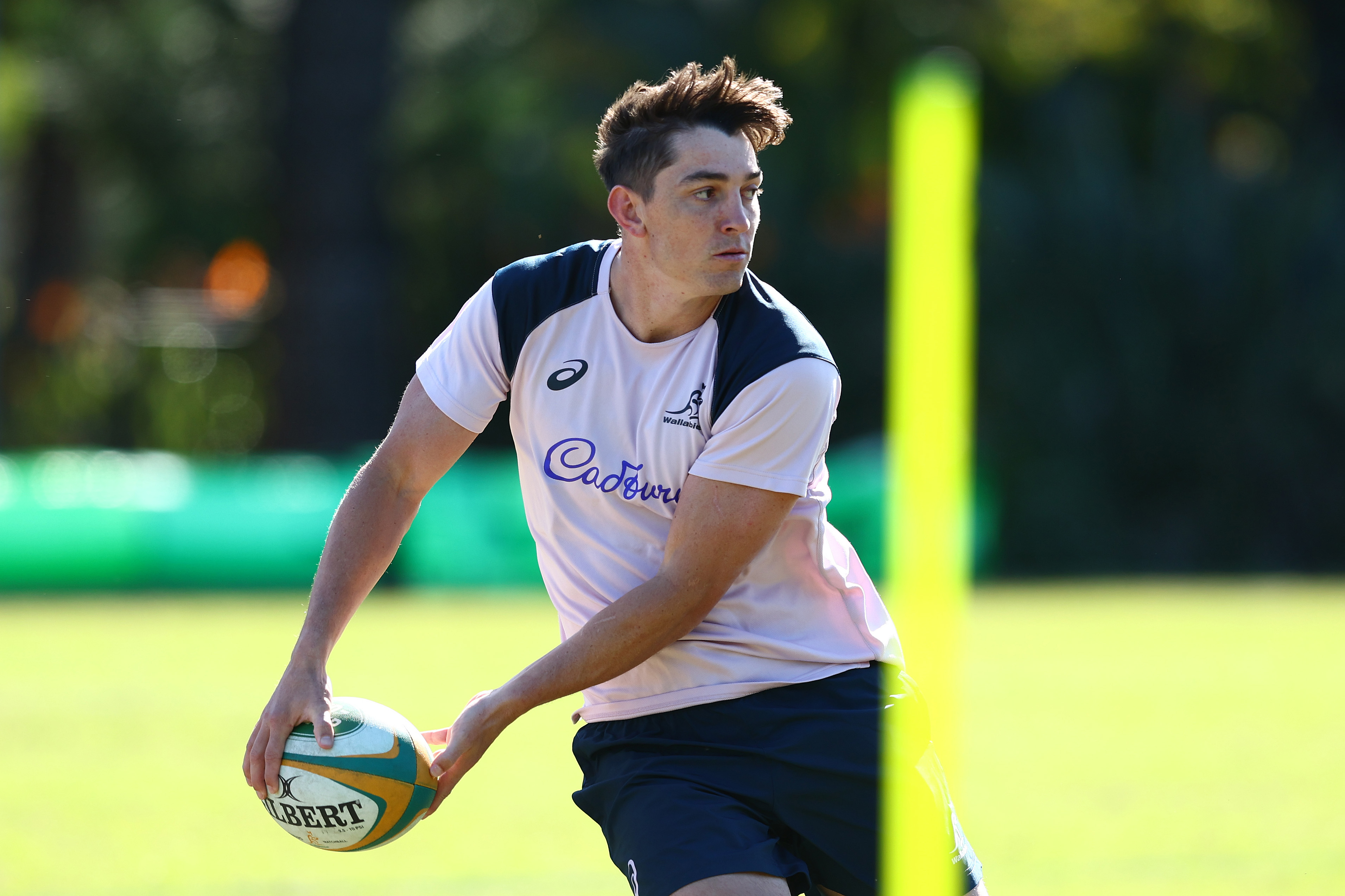 Jock Campbell passes during a Wallabies training session at Royal Pines Resort.