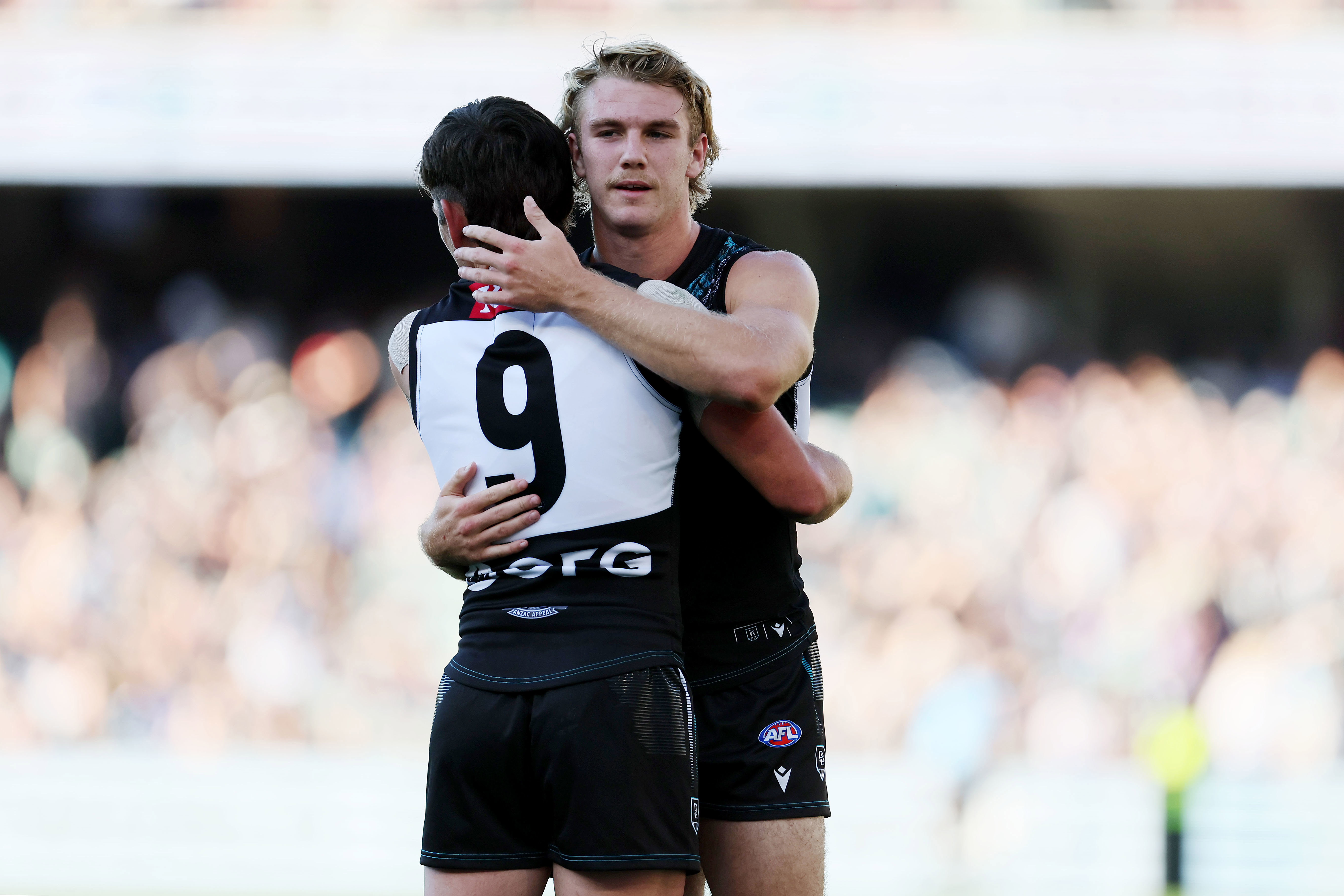 ADELAIDE, AUSTRALIA - APRIL 22: Zak Butters and Jason Horne-Francis of the Power celebrate their win during the 2023 AFL Round 06 match between the Port Adelaide Power and the West Coast Eagles at Adelaide Oval on April 22, 2023 in Adelaide, Australia. (Photo by James Elsby/AFL Photos)