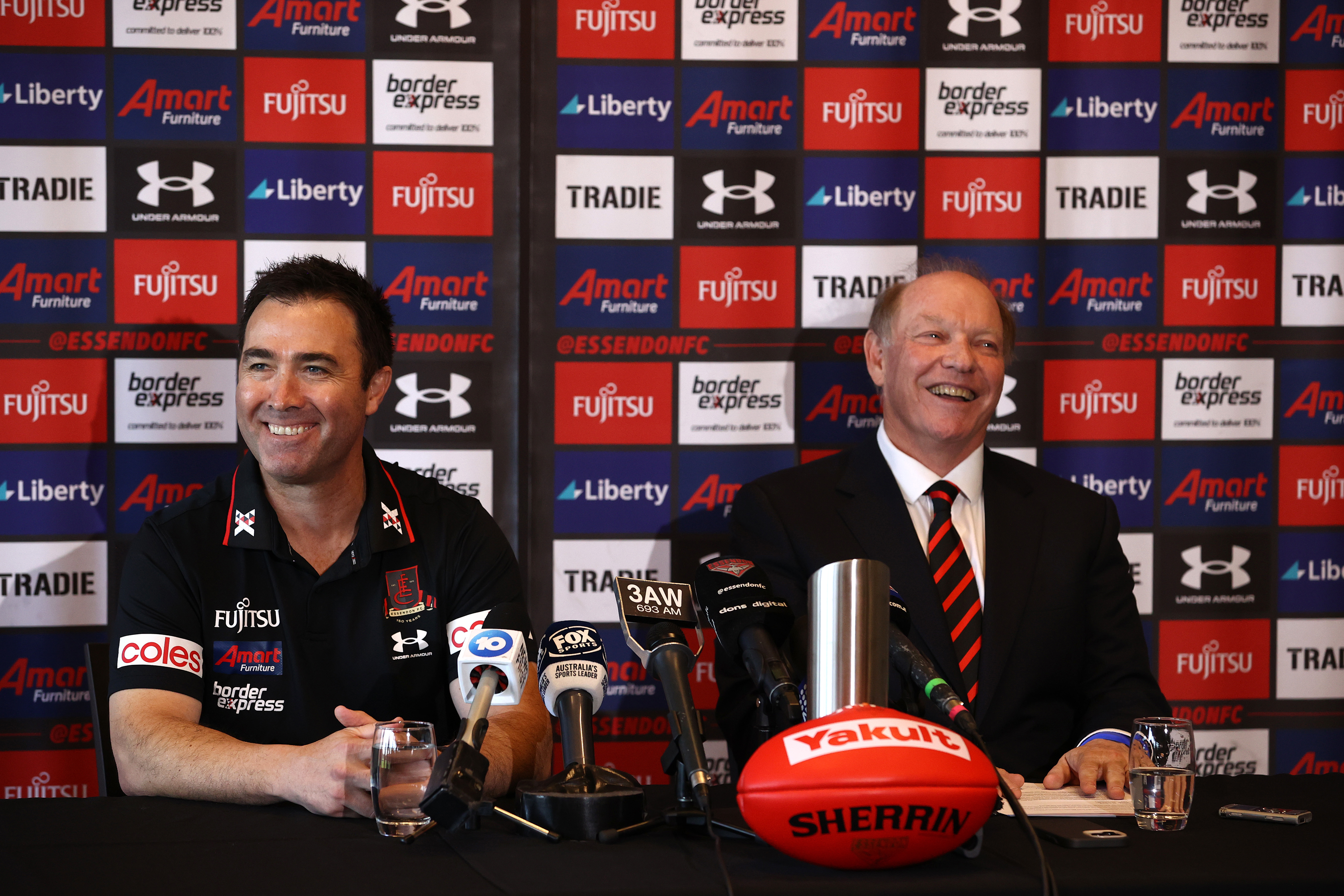 Brad Scott (left) and Essendon president David Barham at the announcement of Scott's appointment to Bombers coach in September 2022.