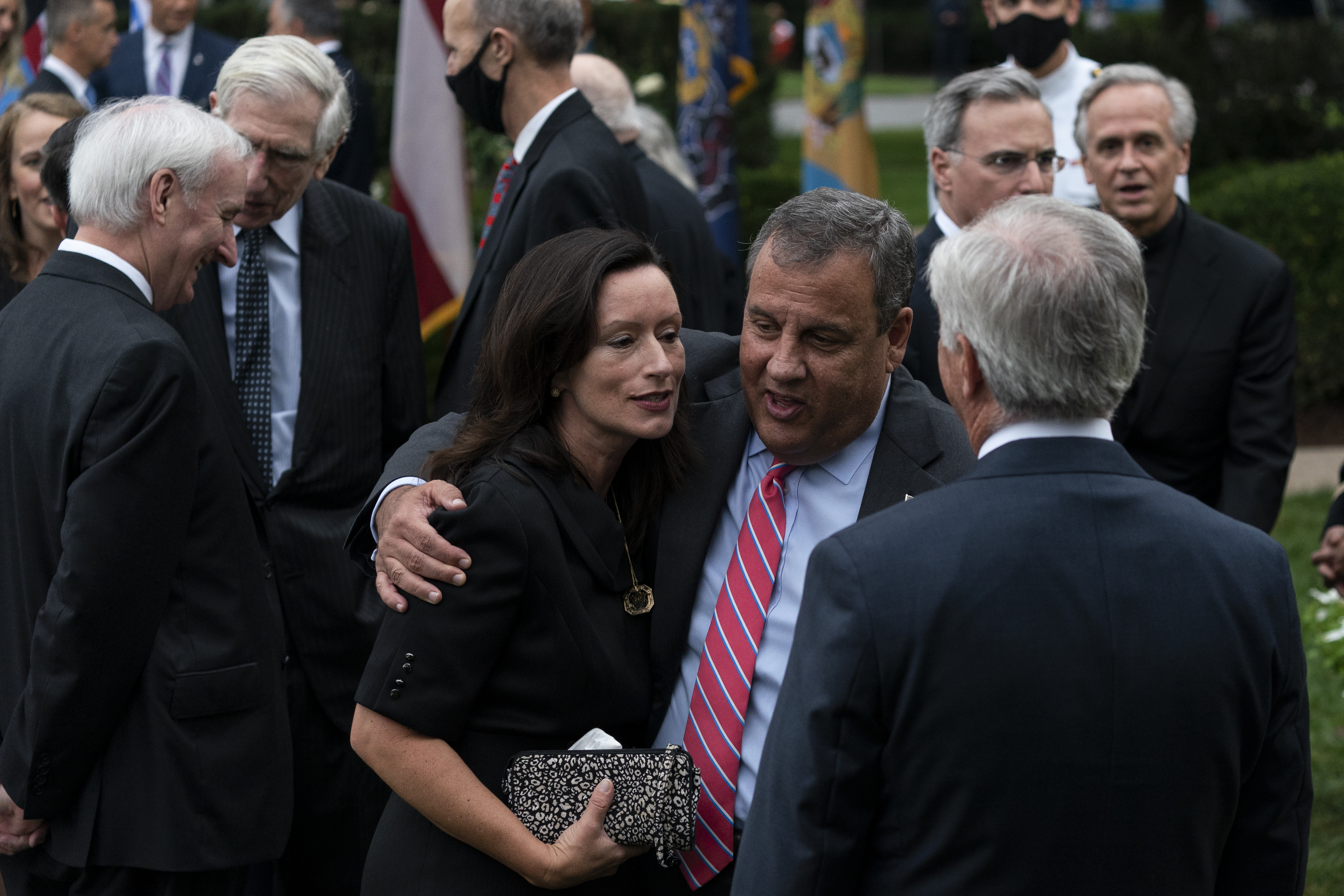 In this Saturday, September 26, 2020, photo former New Jersey Governor Chris Christie, front second from right, is seen in the Rose Garden. Notre Dame President Father John Jenkins stands at back right. Both have since tested positive for the virus. (AP Photo/Alex Brandon)