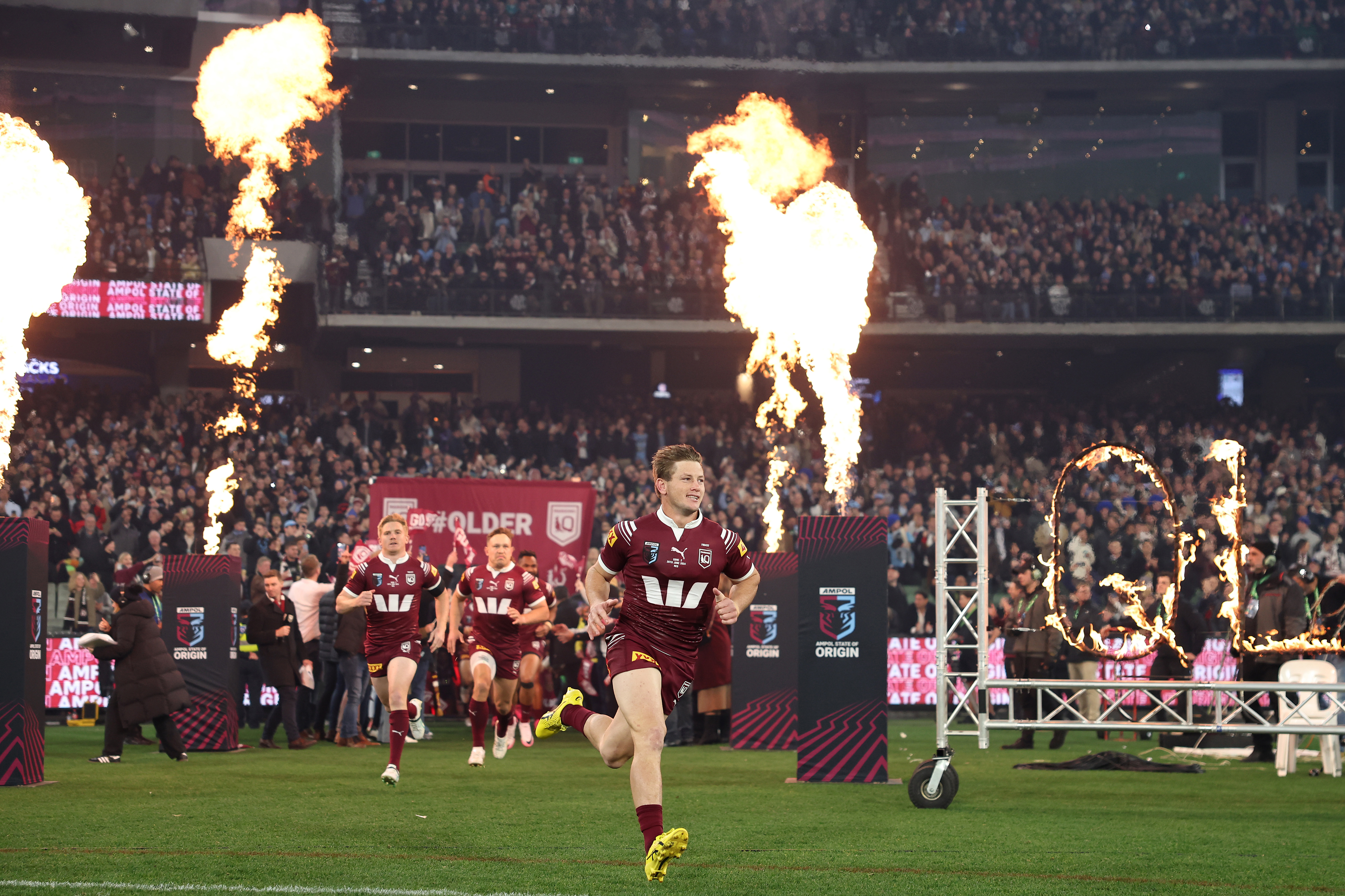 Harry Grant of the Maroons runs onto the MCG.