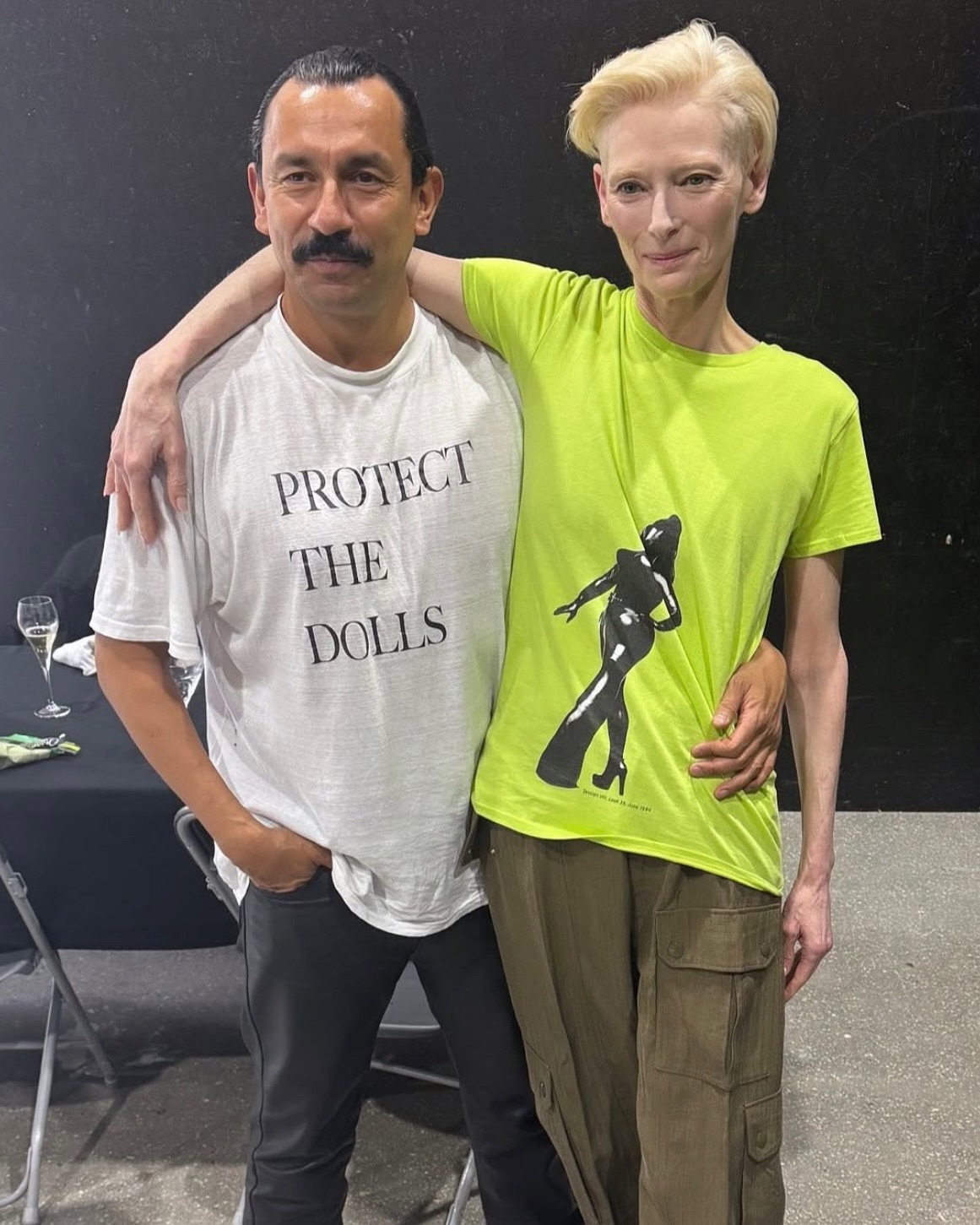 Haider Ackerman wearing Connor Ives' Protect The Dolls shirt 