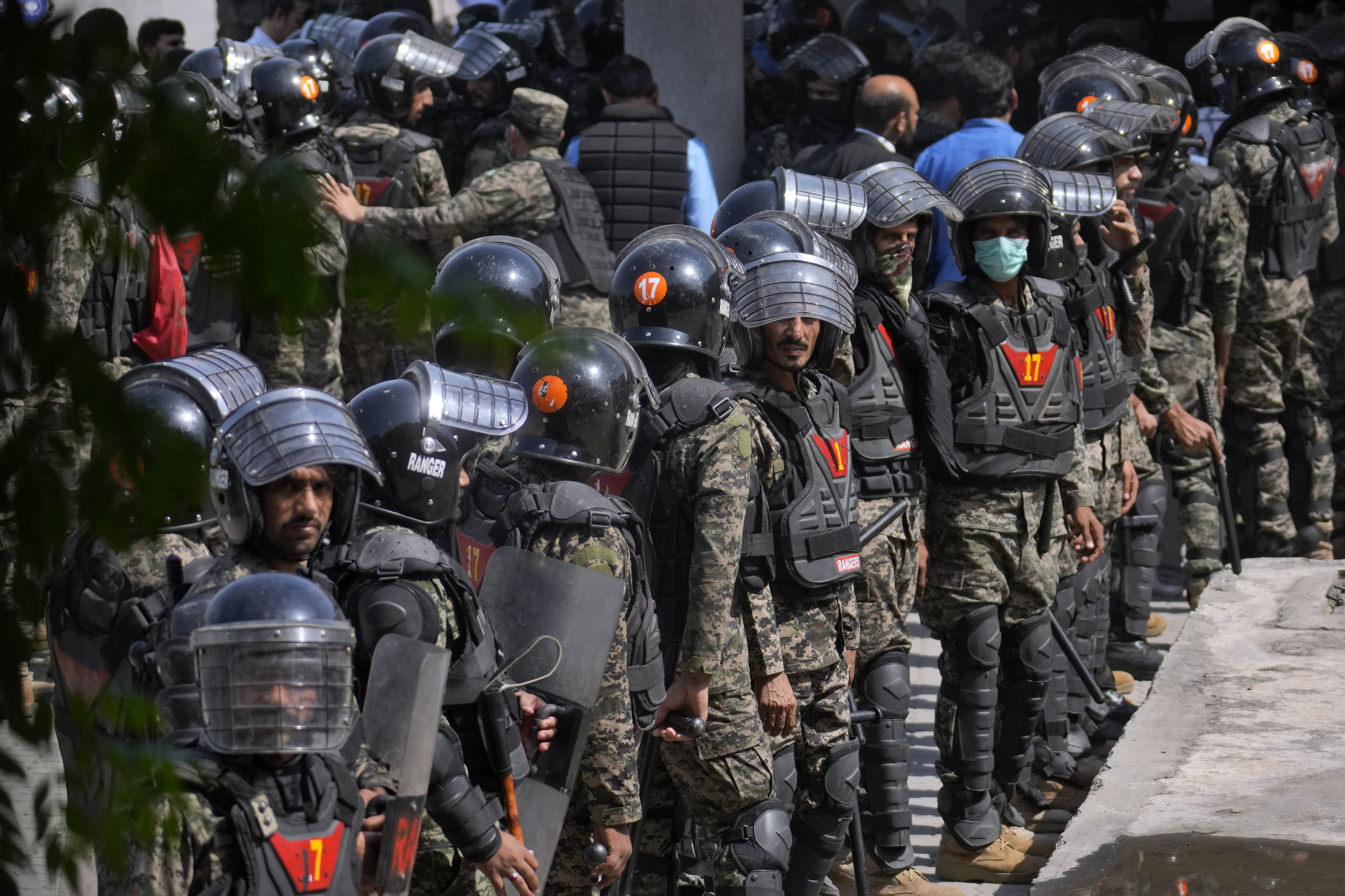 Paramilitary troops take position to ensure security at the premises of Islamabad High court, where Pakistan's former Prime Minister Imran Khan is due to appear, in Islamabad, Pakistan, Friday, May 12, 2023. 