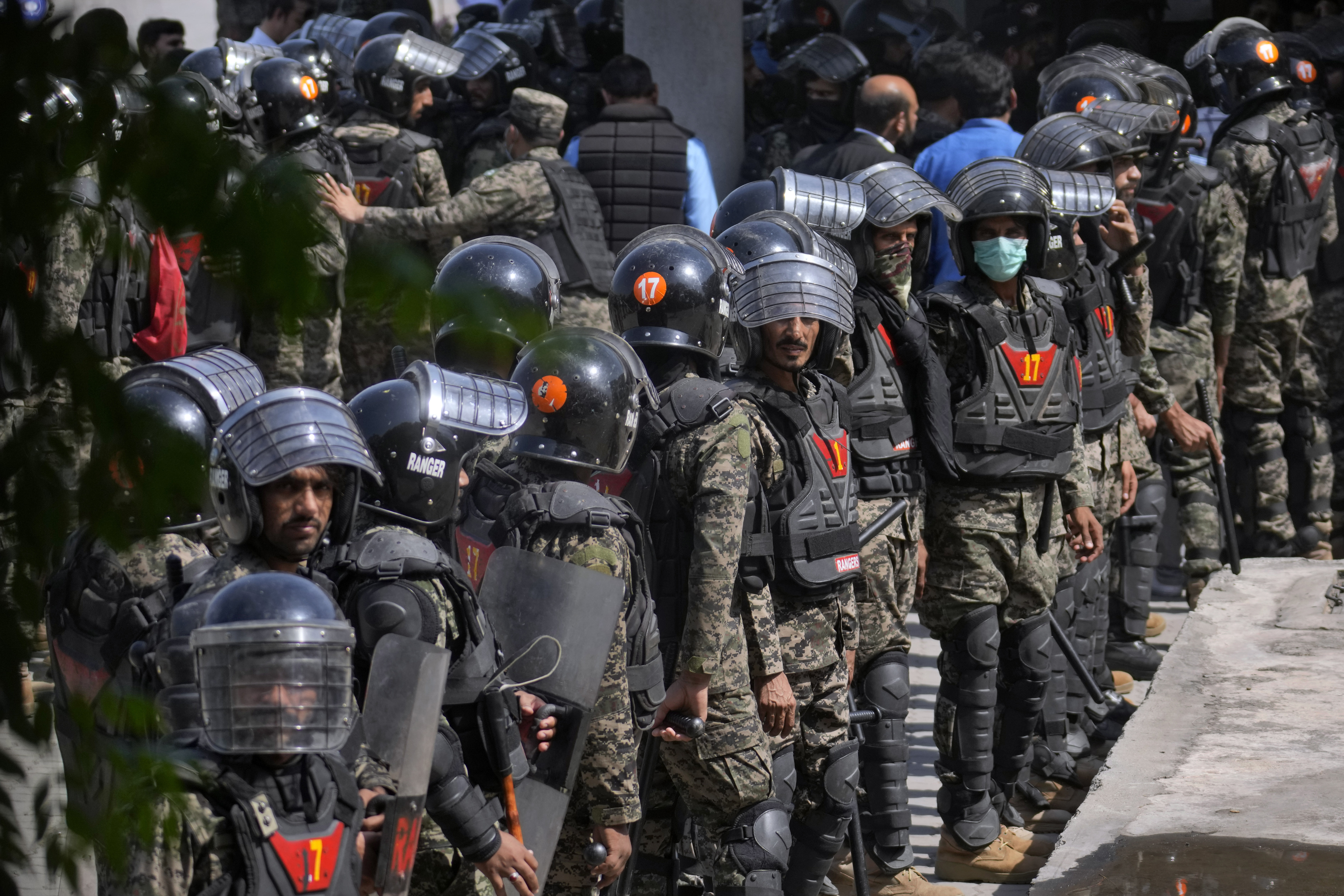 Paramilitary troops take position to ensure security at the premises of Islamabad High court, where Pakistan's former Prime Minister Imran Khan is due to appear, in Islamabad, Pakistan, Friday, May 12, 2023.
