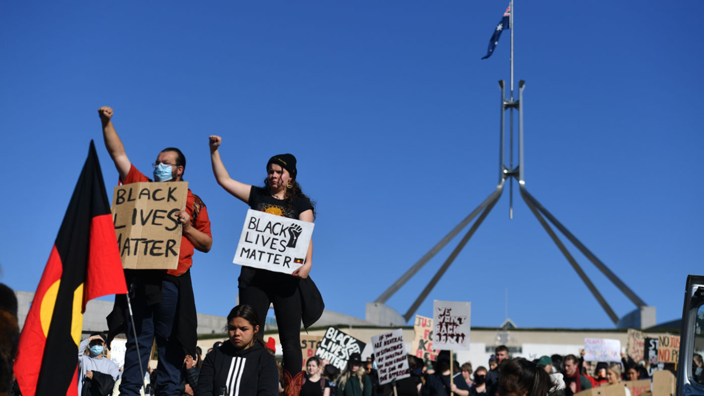 Protesters outside Parliament in Canberra today.