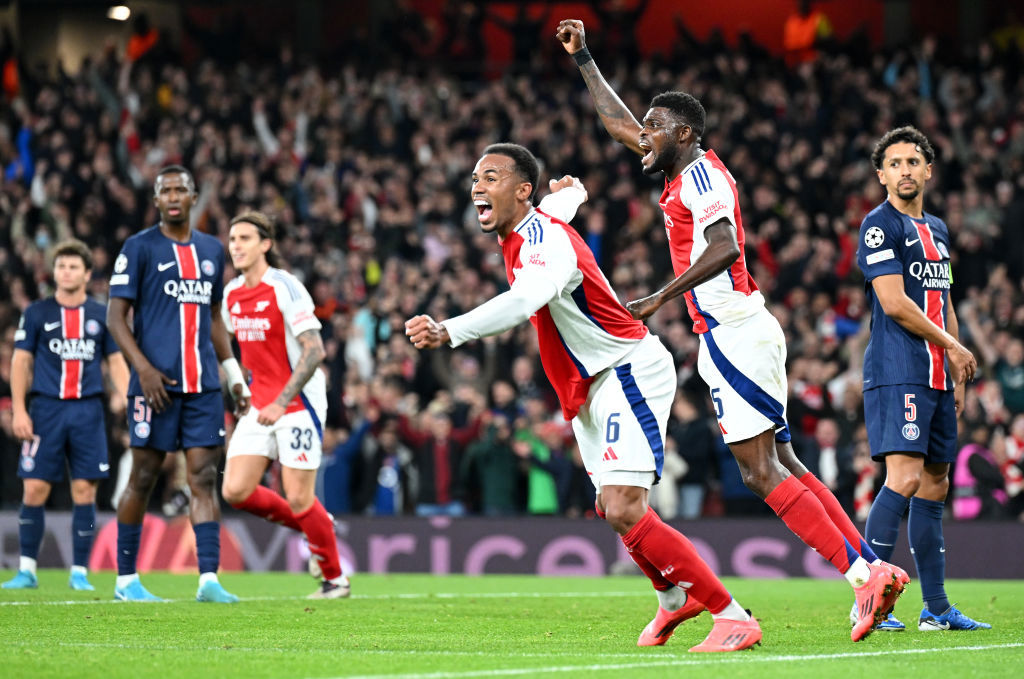 Thomas Partey and Gabriel of Arsenal celebrate after Bukayo Saka scores.