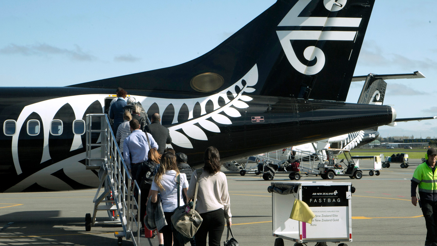 Passengers board an Air New Zealand flight at Christchurch Airport in Christchurch, New Zealand