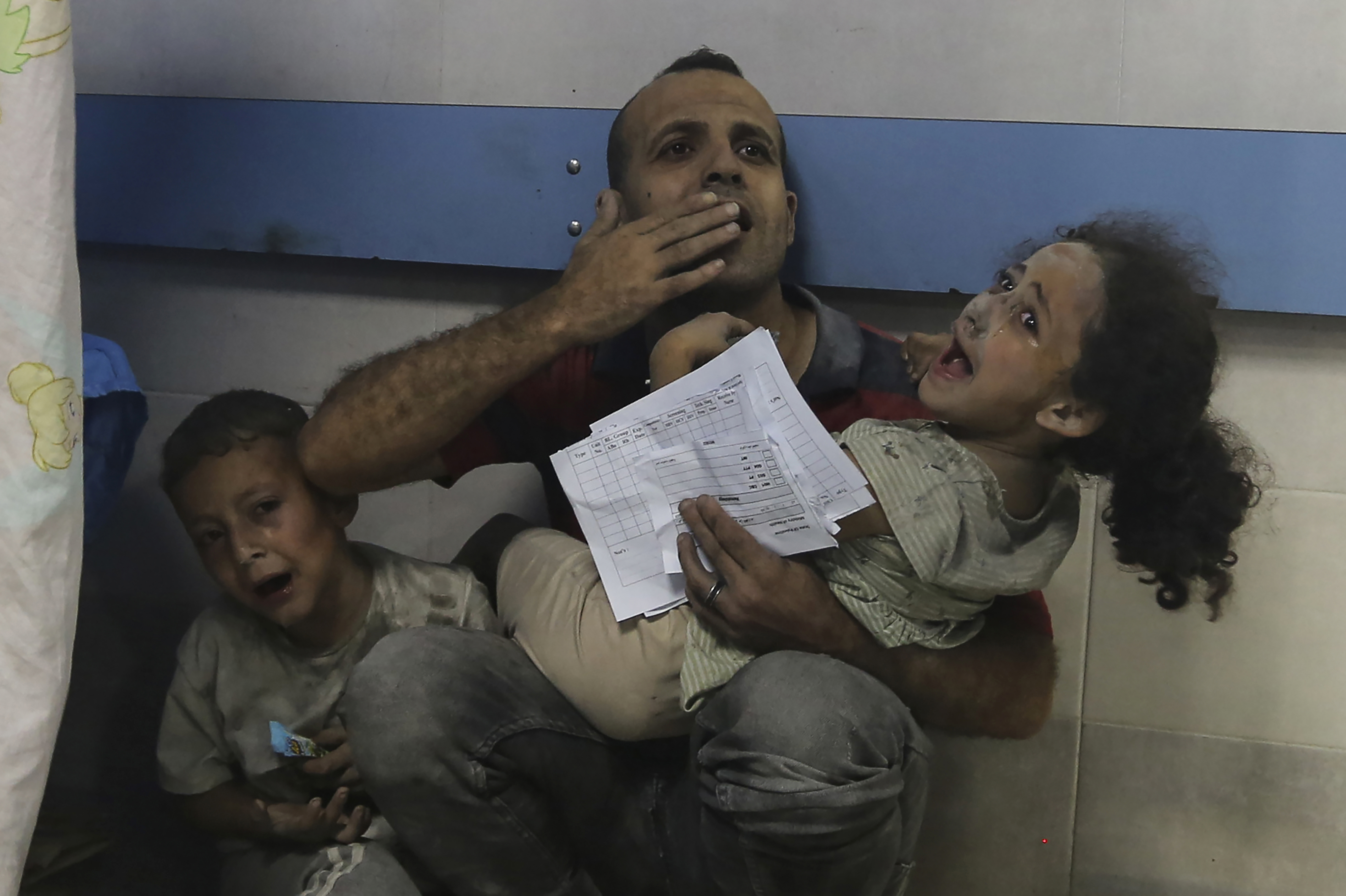 Wounded Palestinians receive treatment at the al-Shifa hospital