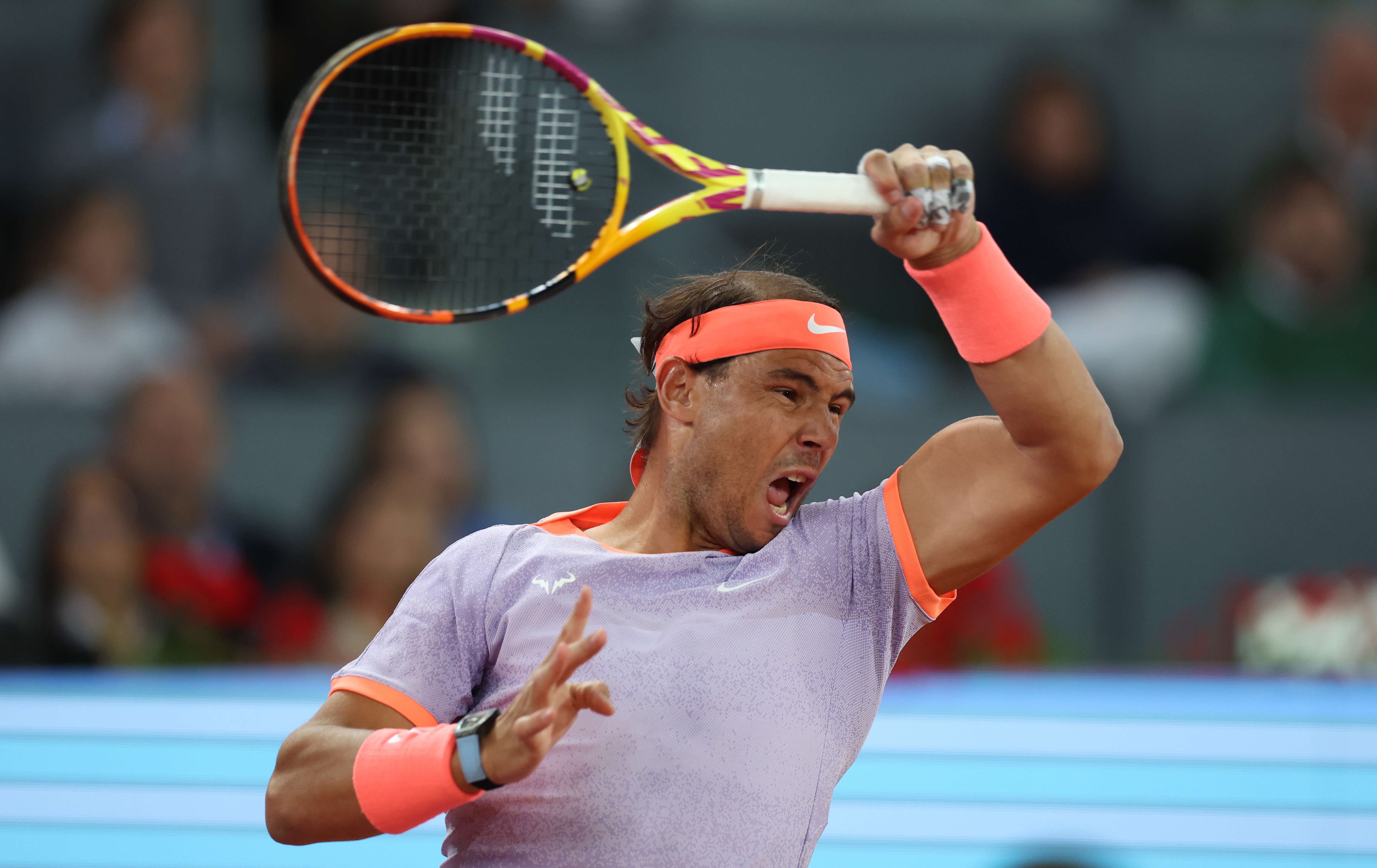 Rafael Nadal of Spain plays a forehand against Alex de Minaur of Australia in the Men's Singles Round of 64 match during Day Five of the Mutua Madrid Open at La Caja Magica on April 27, 2024 in Madrid, Spain. (Photo by Clive Brunskill/Getty Images)