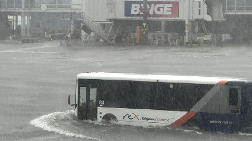 Heavy rain has caused flash flooding at Sydney Airport.