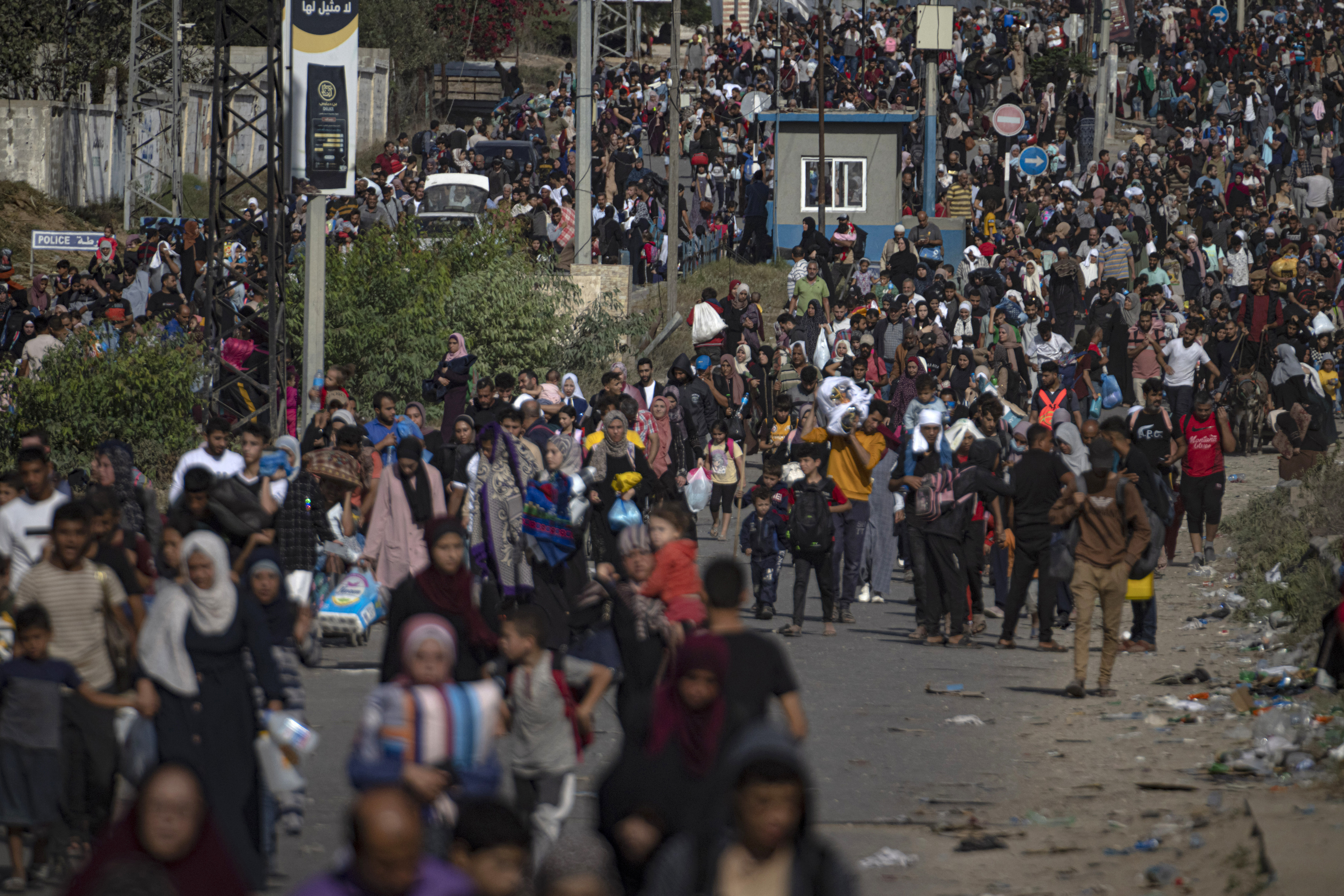 Palestinians flee to the southern Gaza Strip on Salah al-Din Street in Bureij, Gaza Strip on Friday, November 10. (AP Photo/Fatima Shbair)