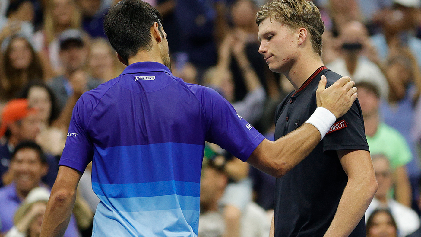 Novak Djokovic speaks with Jenson Brooksby after their fourth round match at the US Open.