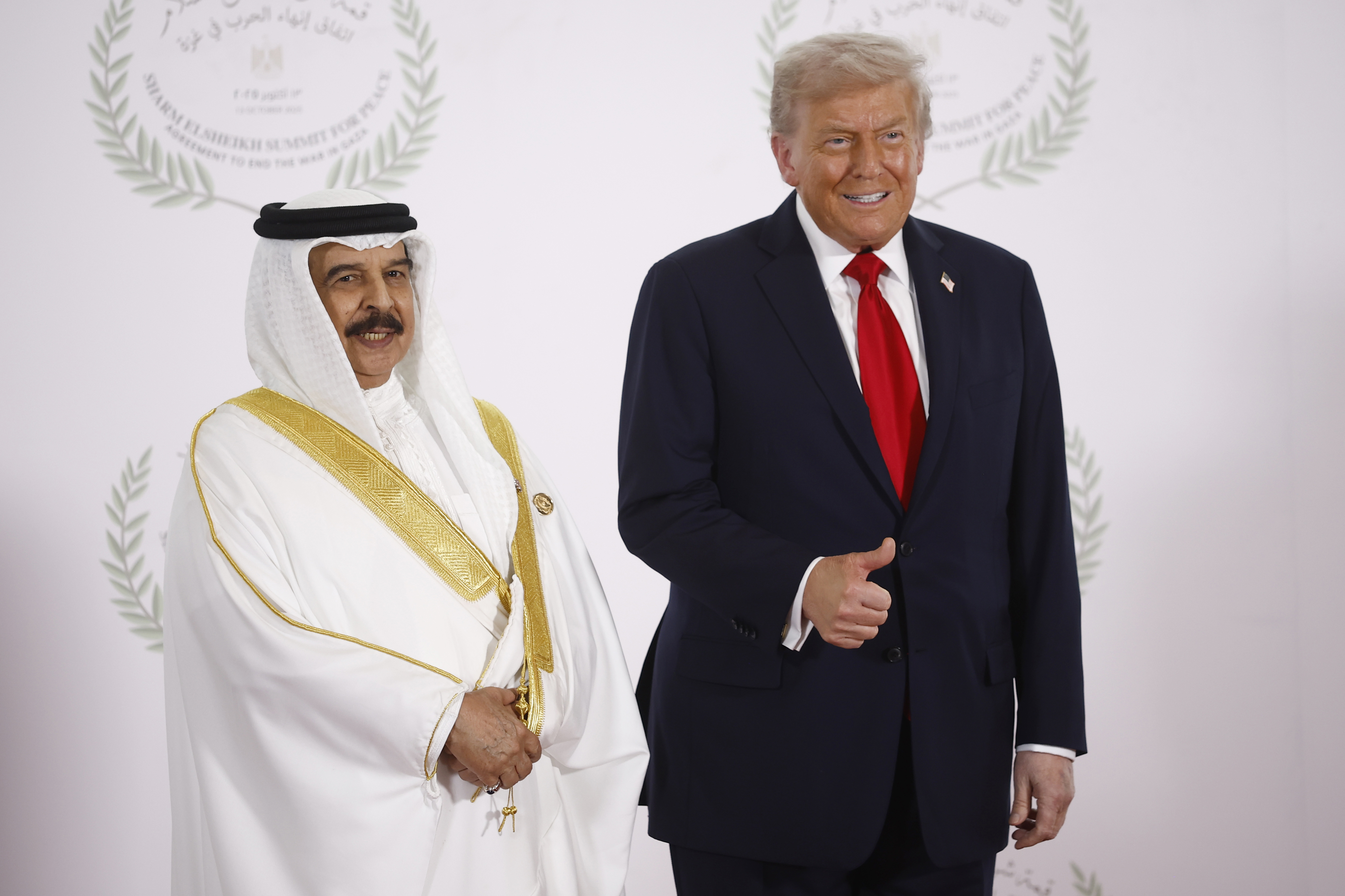 President Donald Trump and Bahrain's King Hamad bin Isa Al Khalifa pose during the family picture at the Gaza International Peace Summit, in Sharm el-Sheikh, Egypt, Monday, October 13 2025.