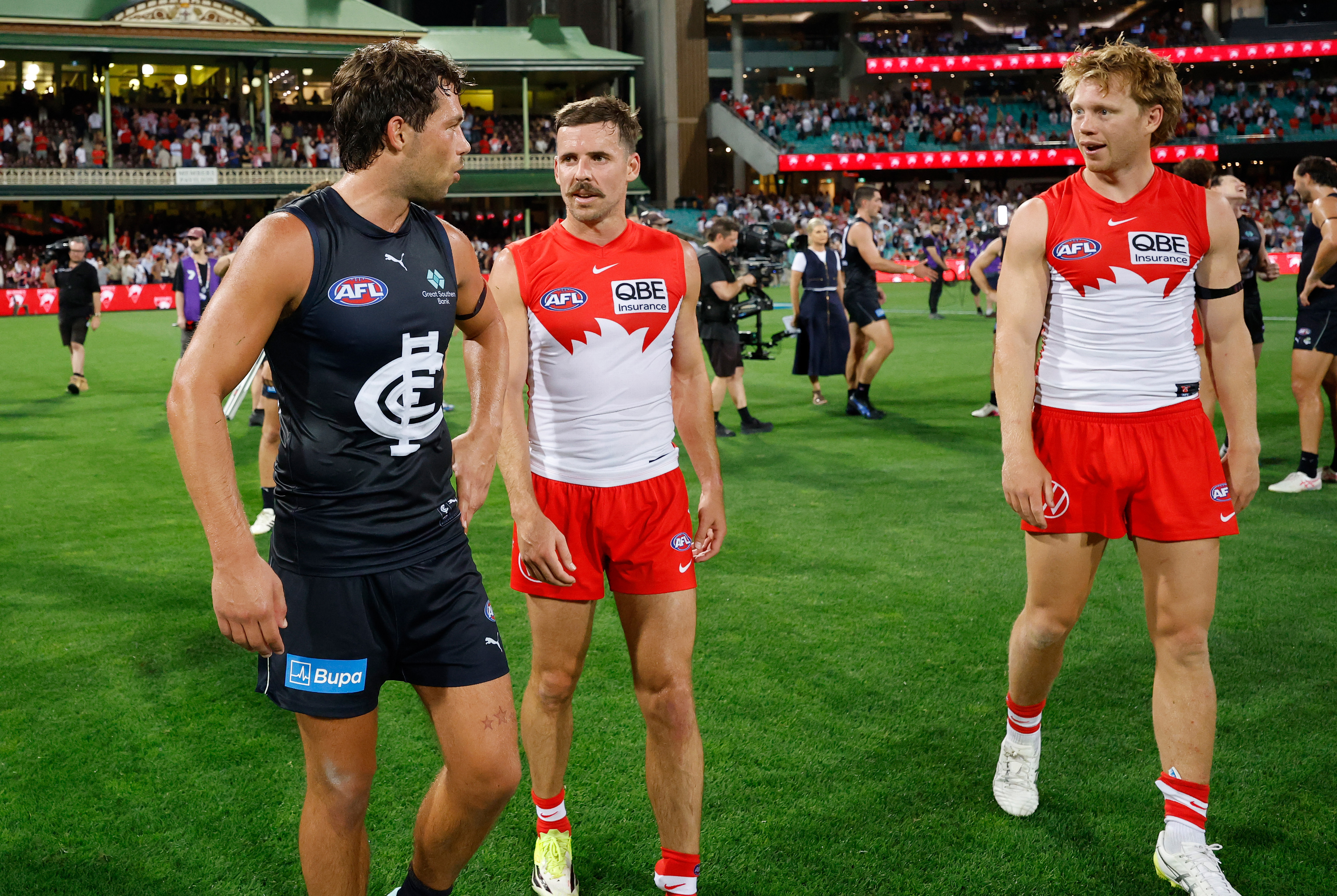 Oliver Florent of the Blues and Callum Mills of the Swans exchange words.