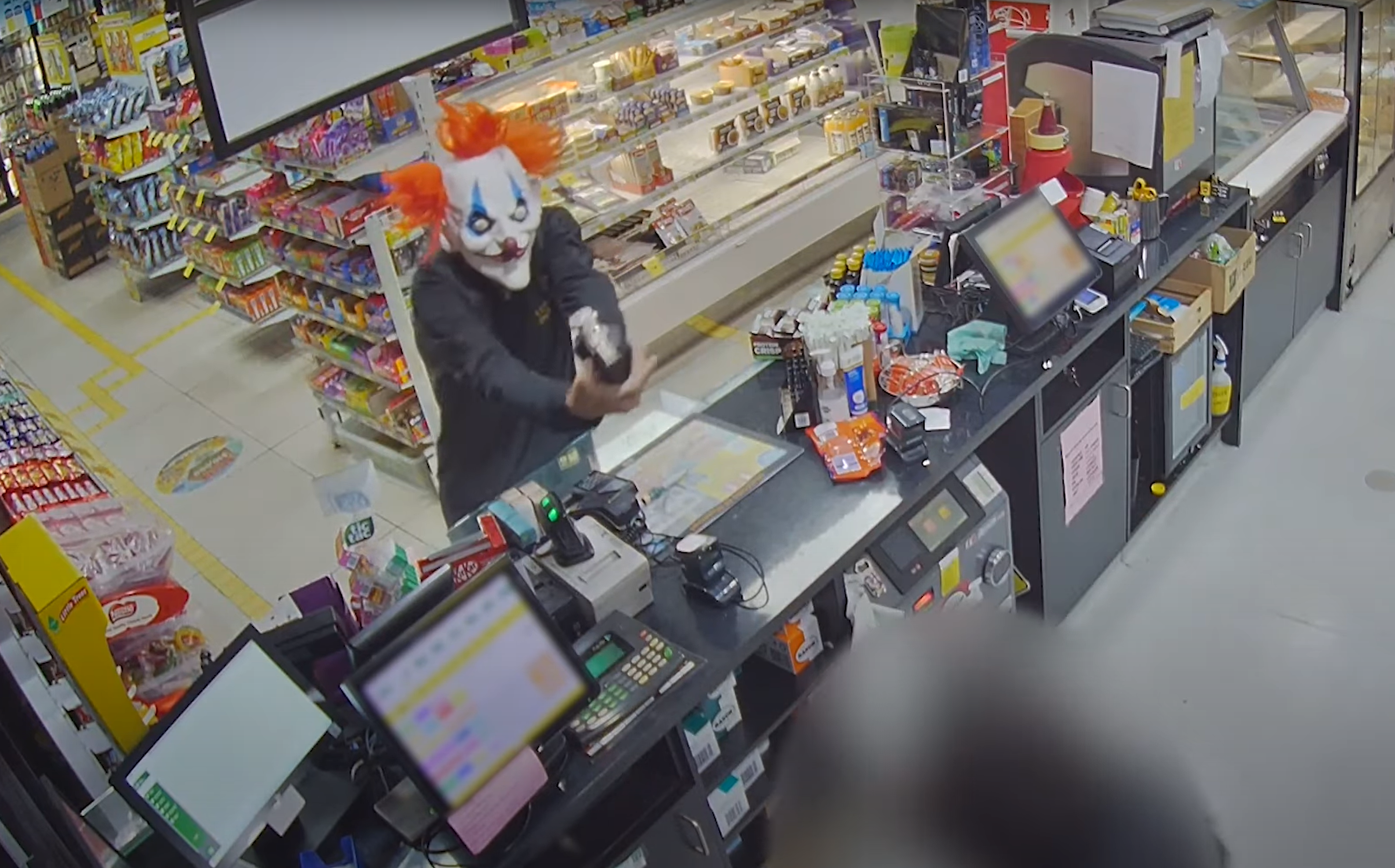 The clown allegedly robbed a service station of cash in Brisbane.