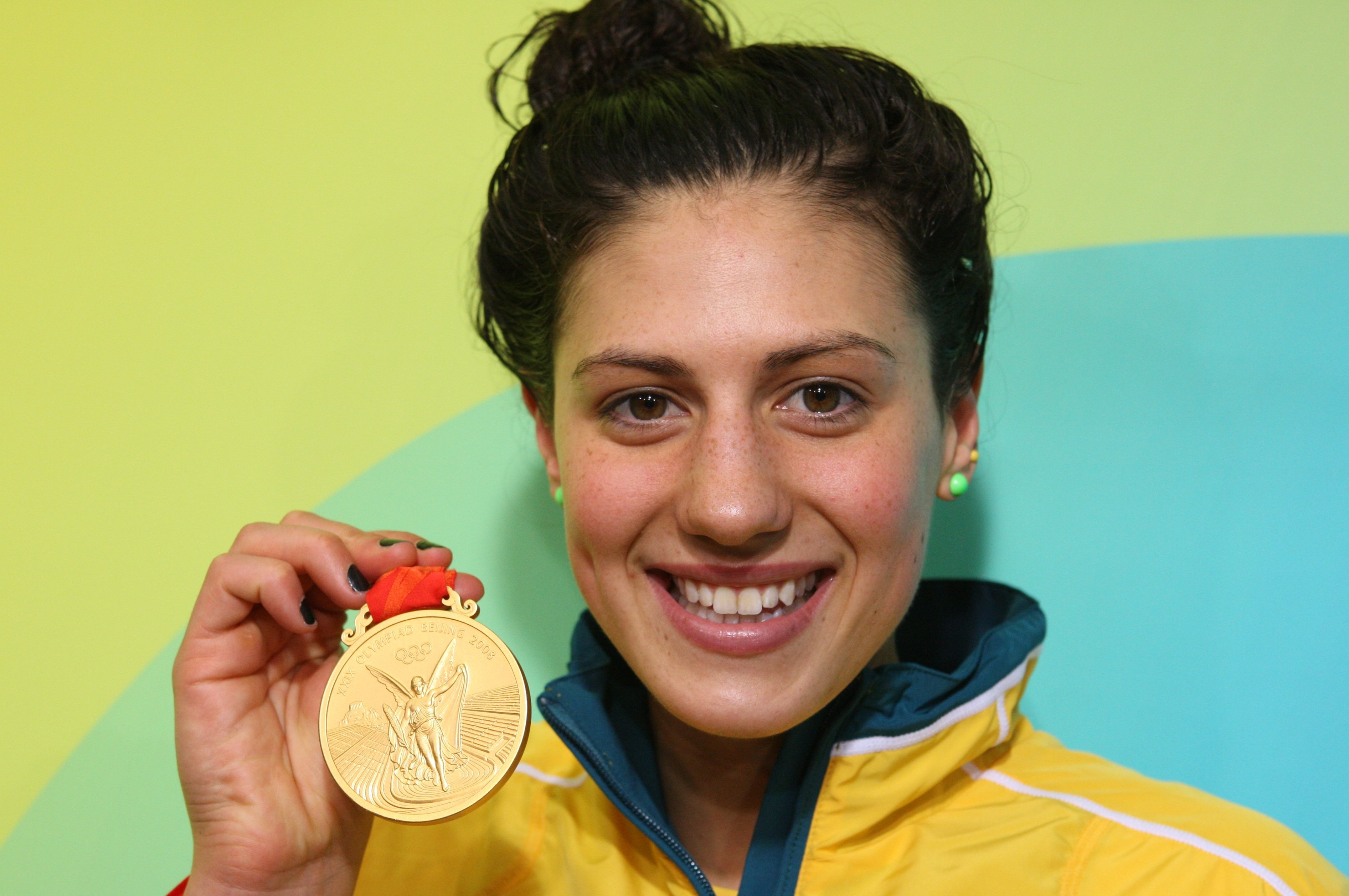 Stephanie Rice poses with one of the two gold medals she won at the Beijing 2008 Olympics.