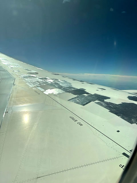 The heavily taped wing of a Qantas jet.
