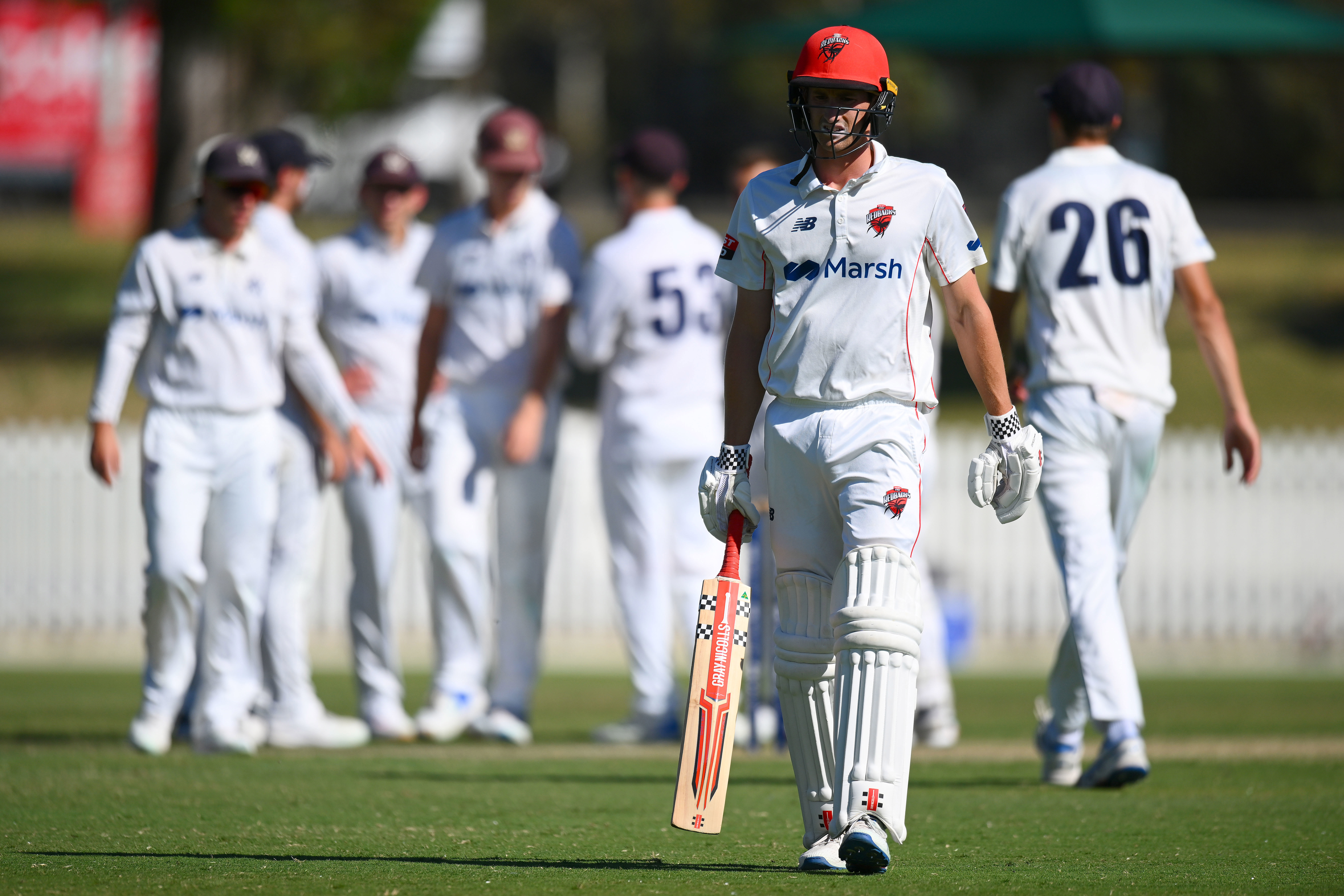 Jake Carder of the Redbacks reacts to losing his wicket during the Sheffield Shield match between Victoria and South Australia.