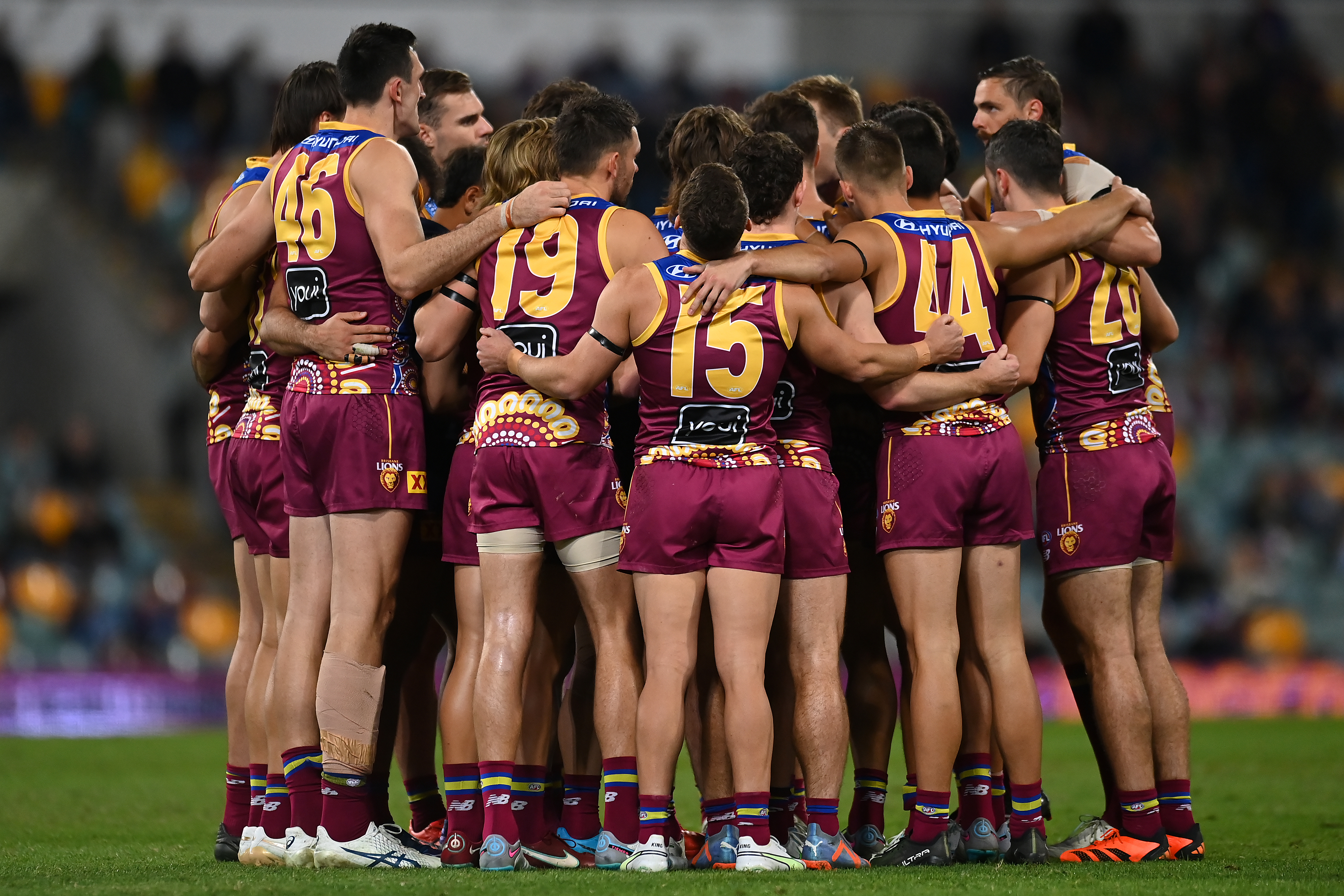 BRISBANE, AUSTRALIA - MAY 20: The Brisbane Lions huddle during the round 10 AFL match between Brisbane Lions and Gold Coast Suns at The Gabba, on May 20, 2023, in Brisbane, Australia. (Photo by Albert Perez/AFL Photos via Getty Images)